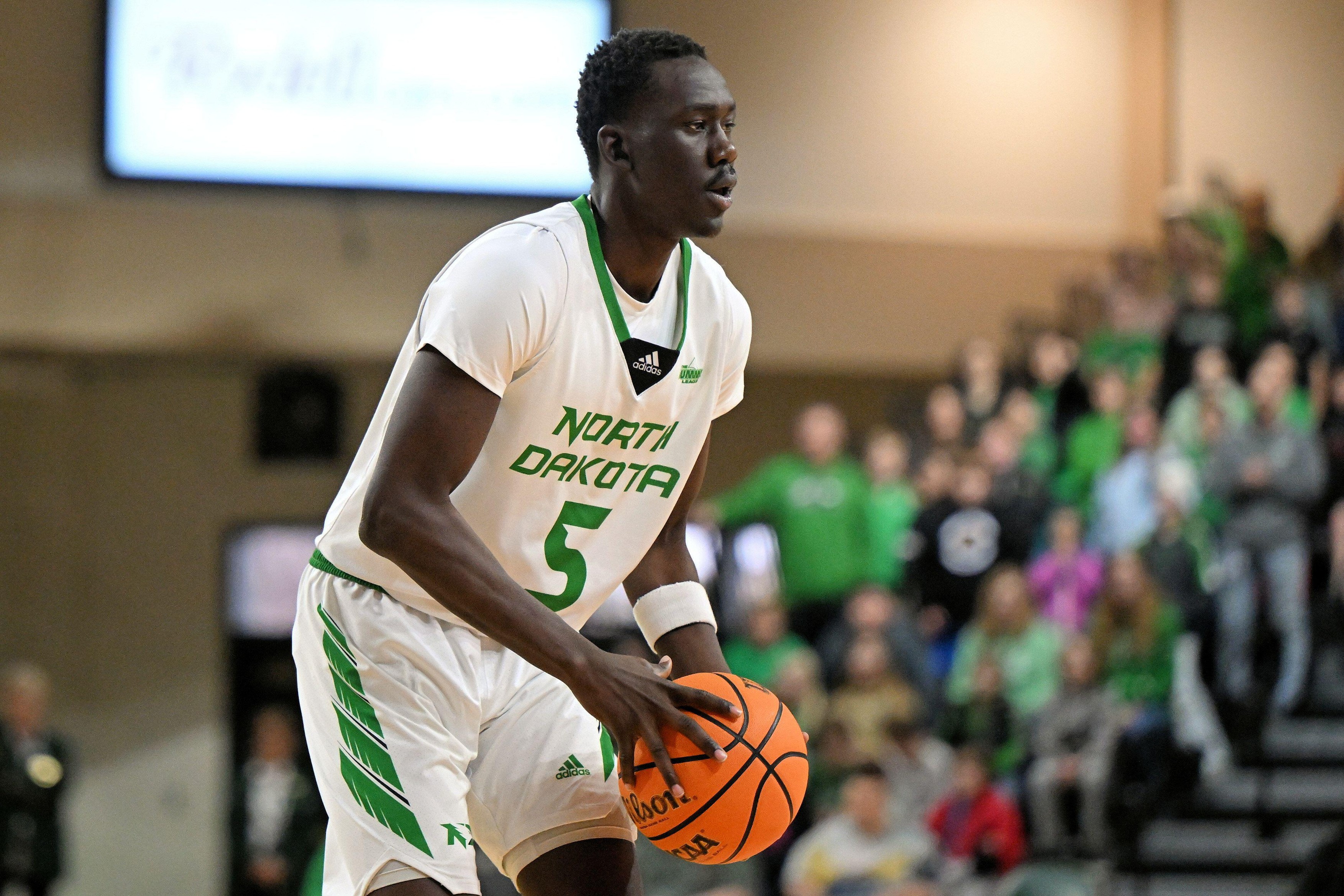 North Dakota Fighting Hawks forward Deng Mayar (5) looks to pass the ball during an NCAA men's pre-season basketball game between the Utah Valley University Wolverines and the University of North Dakota Fighting Hawks at Betty Engelstad Sioux Center in Gr