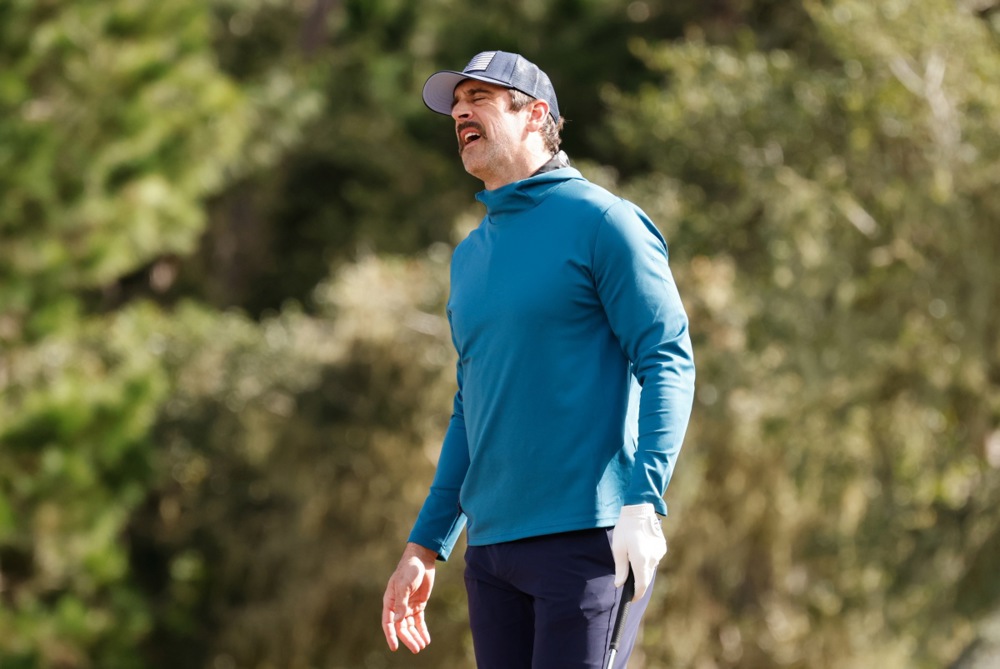 epa11119075 NFL quarterback Aaron Rodgers reacts to a shot on the 14th hole during the first round of the AT&amp;T Pebble Beach Pro-Am golf tournament at Spyglass Hill  in Pebble Beach, California, USA, 01 February 2024.  EPA/MICHAEL FIALA