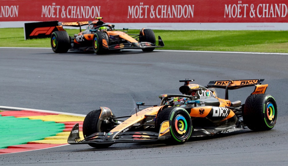 epa12266052 McLaren driver Oscar Piastri (front) of Australia and McLaren driver Lando Norris of Britain in action during the 2025 Formula 1 Belgian Grand Prix at the Circuit de Spa-Francorchamps, Belgium, 27 July 2025.  EPA/OLIVIER MATTHYS