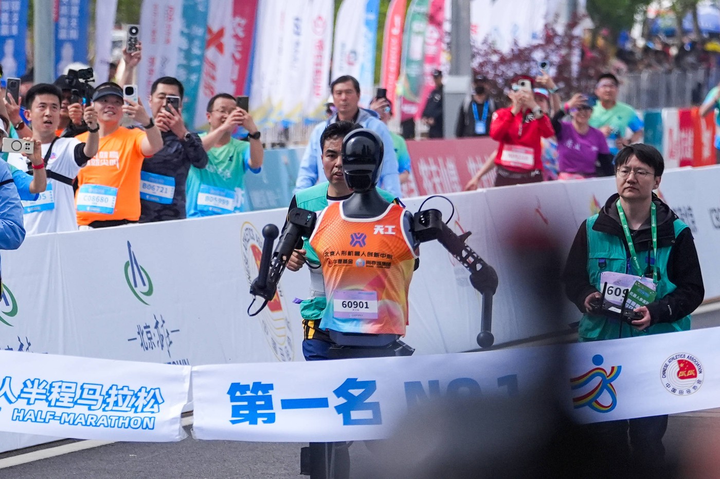 BEIJING, CHINA - APRIL 19: Tiangong humanoid robot runner crosses the finish line in the Beijing E-town Half-Marathon an