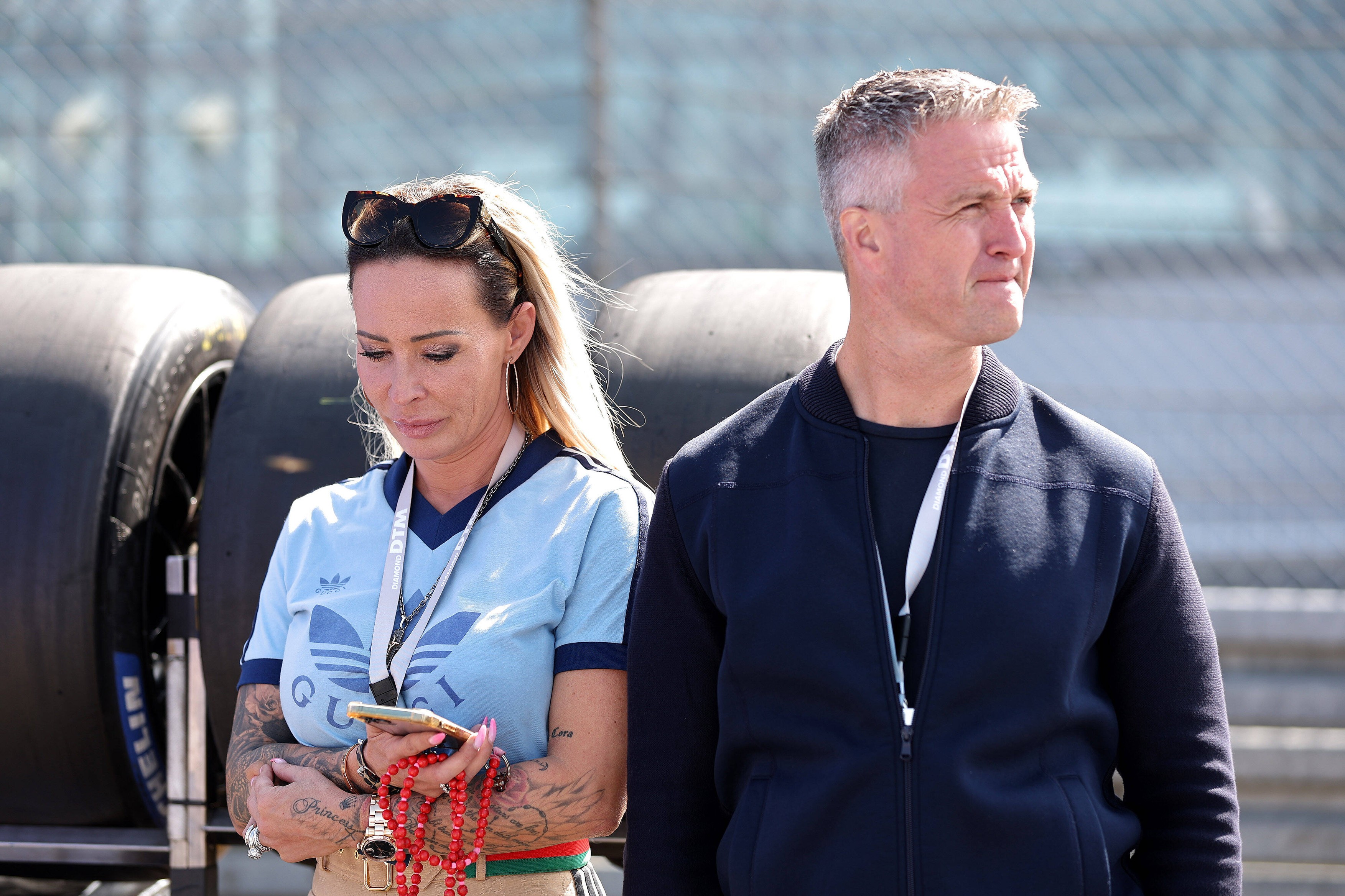 Cora Schumacher und Ralf Schumacher (ehemaliger Rennfahrer) beim DTM-Lauf auf dem Nürburgring. Copyright