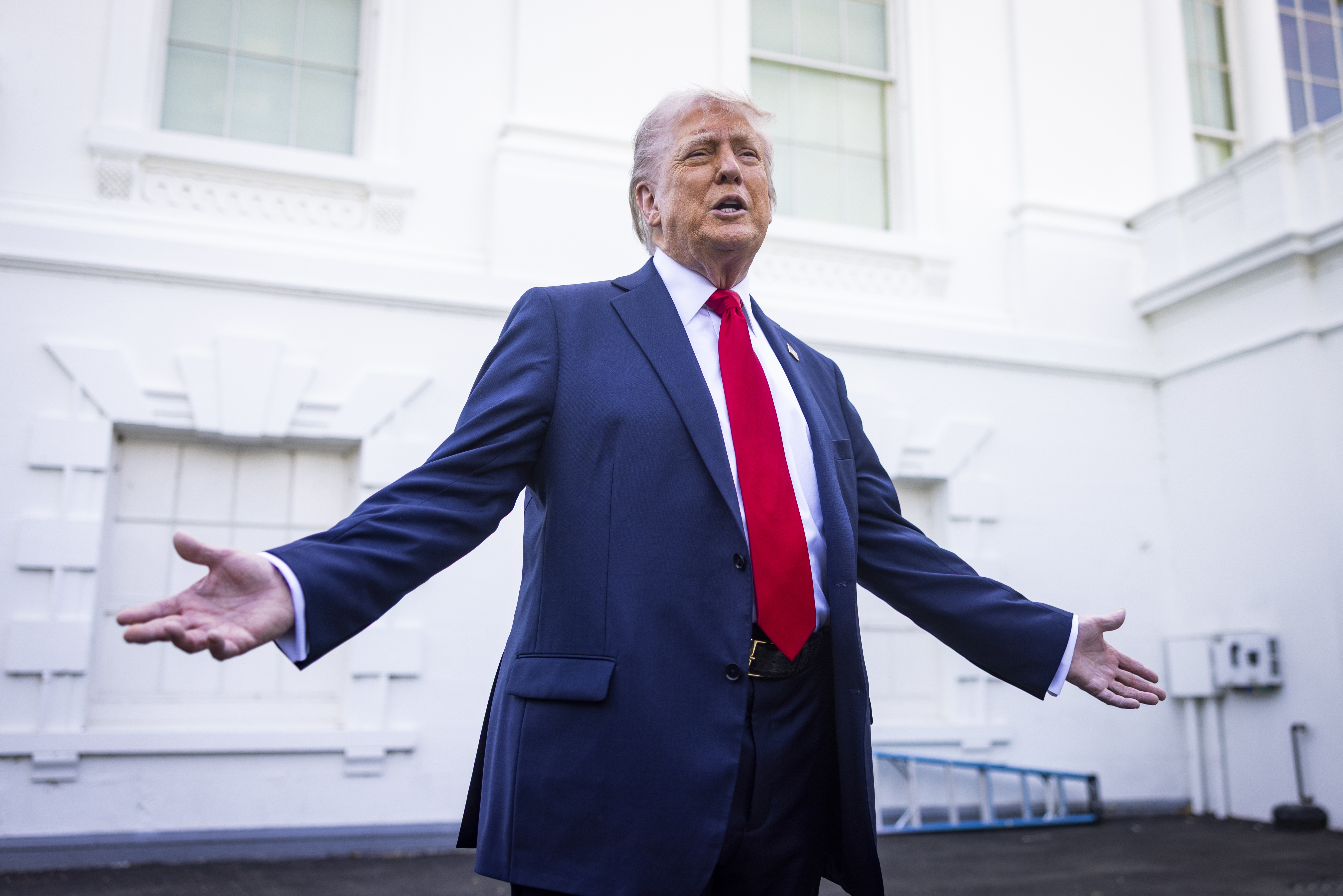 US President Donald Trump makes suprise appearance outside White House