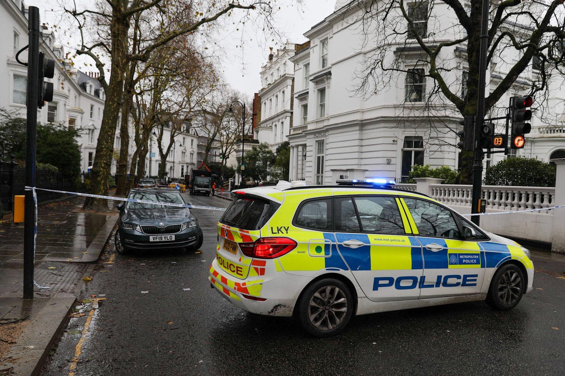 London, UK, 8th December 2024.A police car blocks the road in-front of blue and white tape.In the early hours of Sunday morning a large tree loosened by heavy rain and caught in high winds of storm Darragh fell across a London street.The London Plain tr
