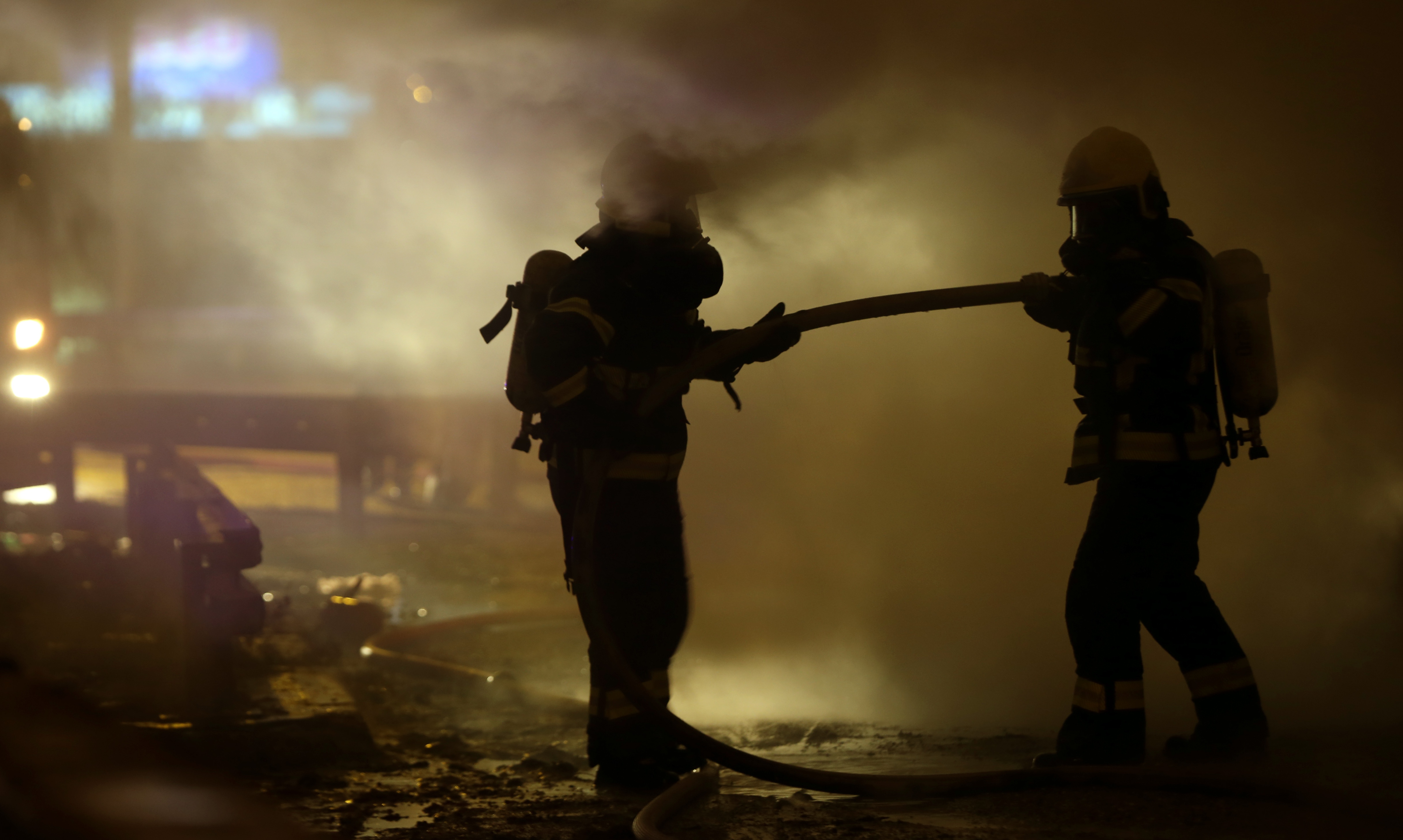 epa06415517  Firefighters extinguish a bus fire in Belgrade, Serbia 3 January 2018. The bus, which was not carrying any passengers at the time,  caught fire due to a mechanical malfunction.  EPA-EFE/KOCA SULEJMANOVIC