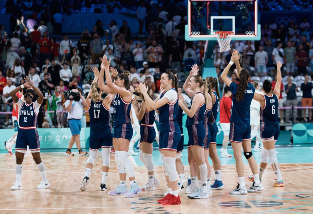 epa11512068 Team Serbia celebrate after winning the Group A match between China and Serbia in the Paris 2024 Olympic Games, at the Pierre Mauroy Stadium in Villeneuve-d'Ascq, France, 31 July 2024.  EPA-EFE/ALEX PLAVEVSKI