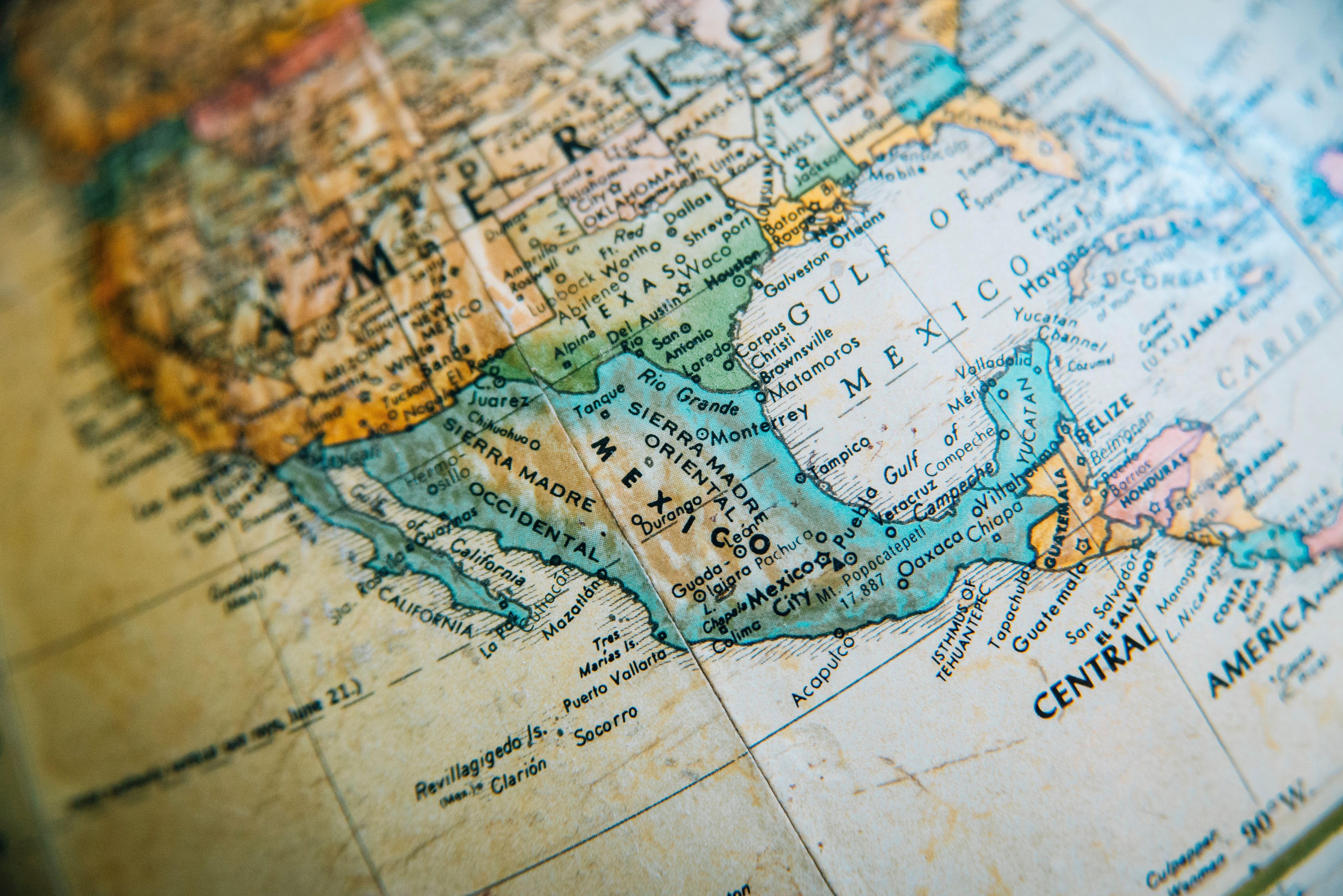 Close-up of a vintage globe map showing Mexico and the Gulf of Mexico with surrounding areas.