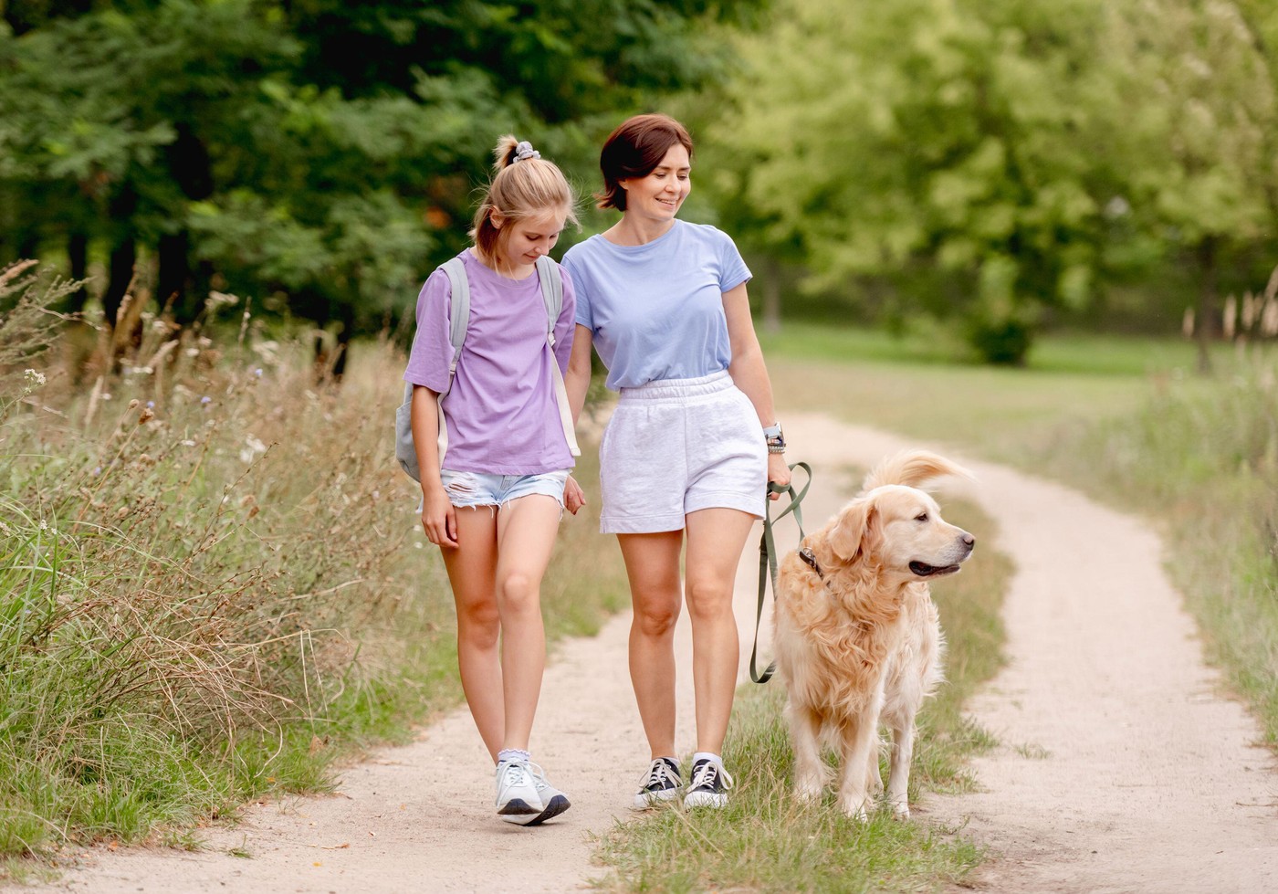 Mother And Daughter Walking A Golden Retriever In The Park And Feeling Happy This Summer,Image: 966992335, License: Royalty-free, Restrictions: , Model Release: yes, Credit line: Tetyana Vychegzhanina / Alamy / Profimedia
