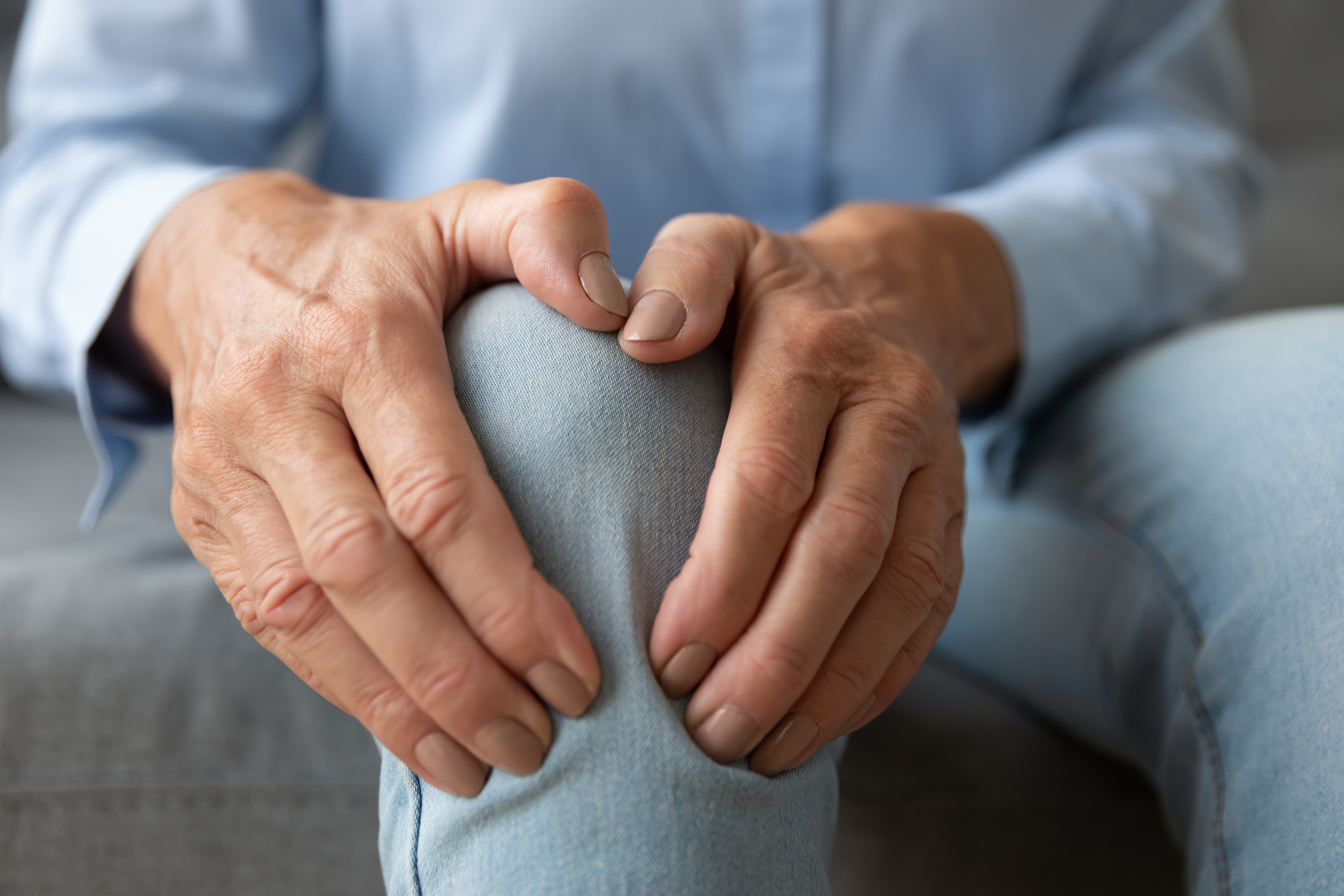 Old,Senior,Adult,Woman,Female,Hands,Touching,Knee,Sitting,Alone,