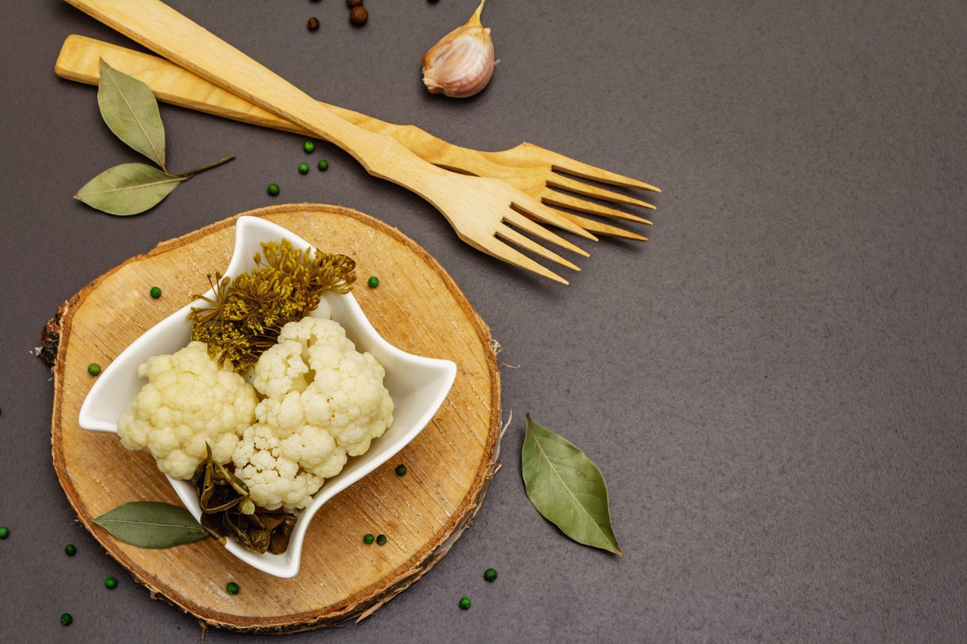 Homemade sauerkraut village fermented cauliflower. Vegan salad rustic style in ceramic bowl. Fermented food great for good health. Traditional rustic