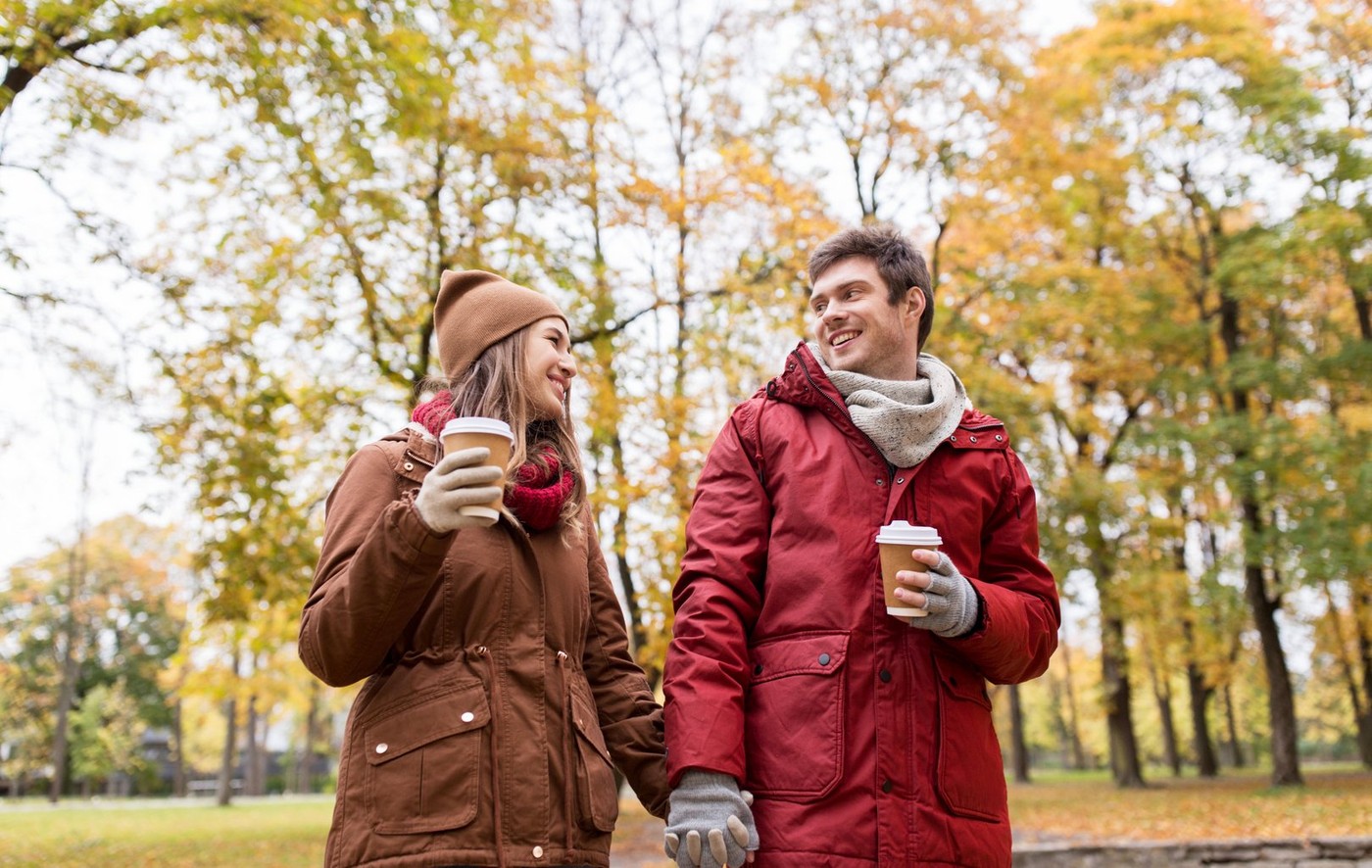 love, relationships, season and people concept - happy young couple with coffee cups walking in autumn park,Image: 306094700, License: Royalty-free, Restrictions: , Model Release: yes, Credit line: Lev Dolgachov / Alamy / Alamy / Profimedia