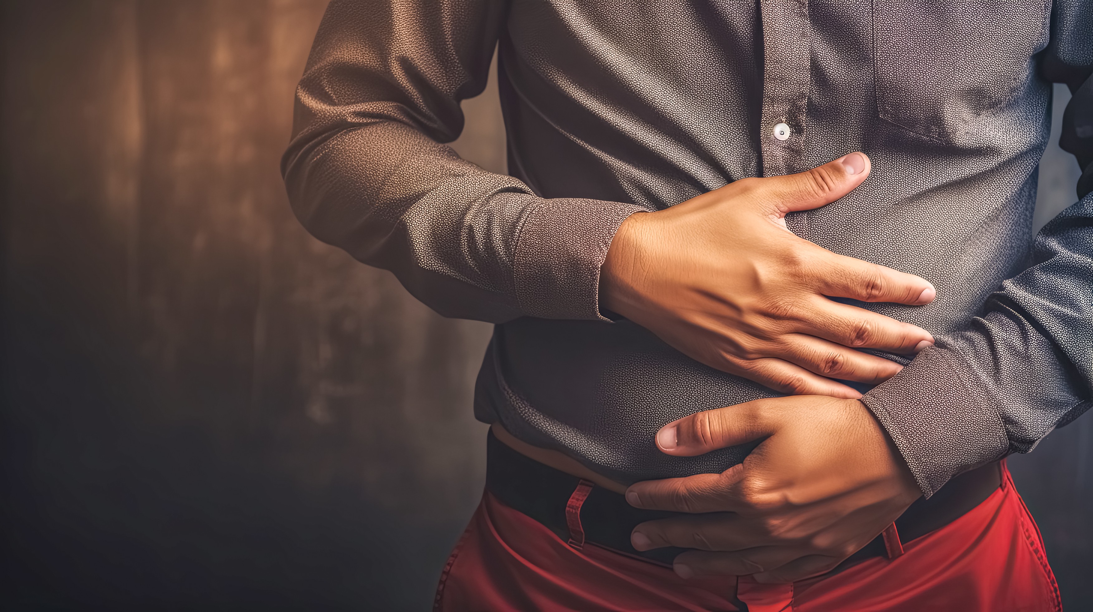 Close-up of a male adult experiencing severe abdominal pain,  holding his stomach,Image: 853092453, License: Royalty-free, Restrictions: , Model Release: no, Credit line: Eduard Goričev / Panthermedia / Profimedia