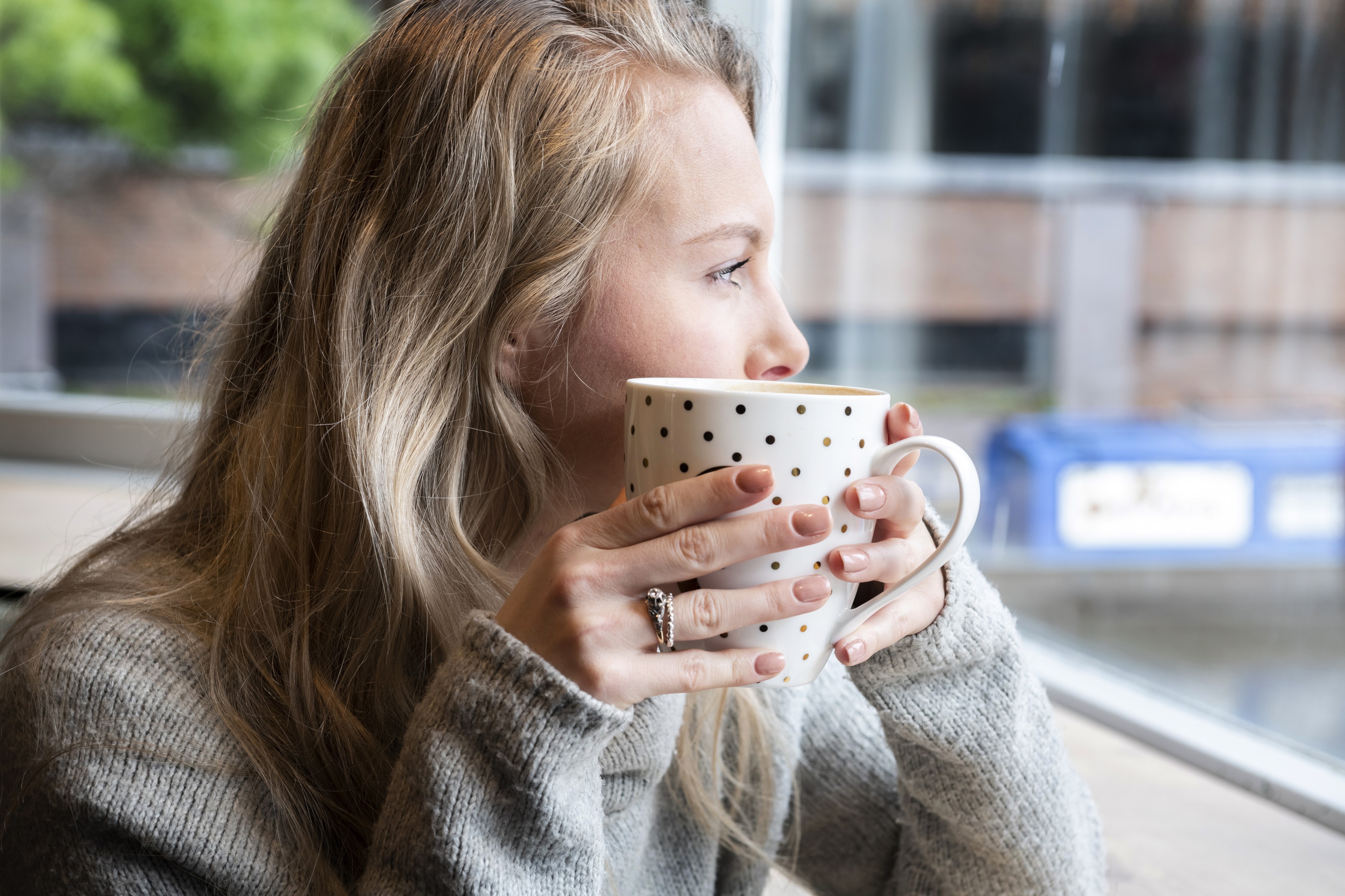 Woman having tea in cafe