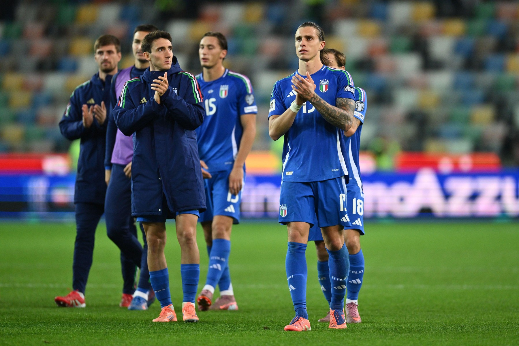 Andrea Cambiaso (ITA) and Riccardo Calafiori (ITA) are greeting the fans at the end of yhe match during the FIFA 2026 World Cup Qualifying Round Matchday 8 between Italy and Israel at Friuli Stadium on October 14, 2025 in Udine, Italy.