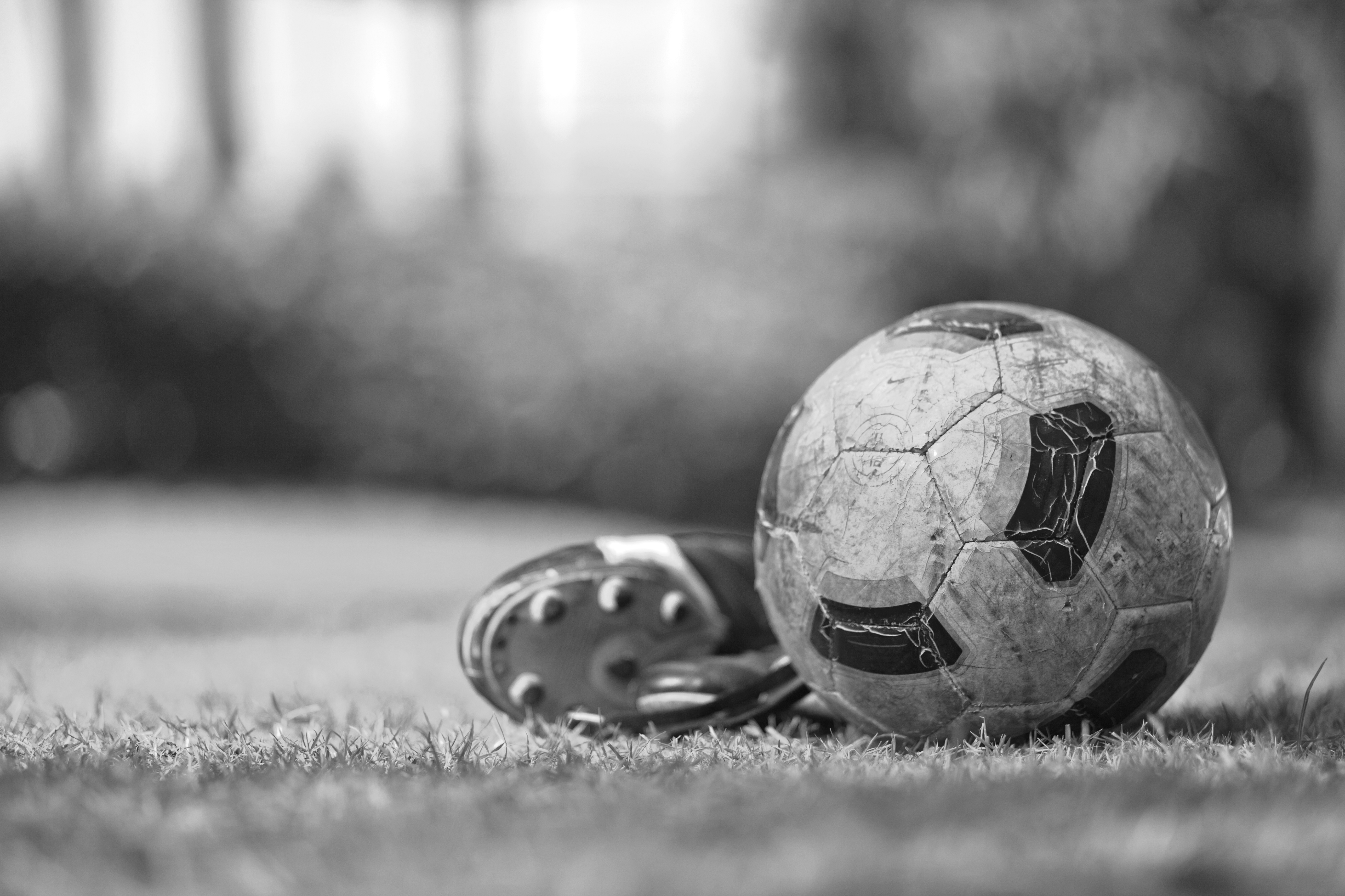 Soccer,Shoes,&amp;,Football,On,The,Green,Grass-filtered,Image