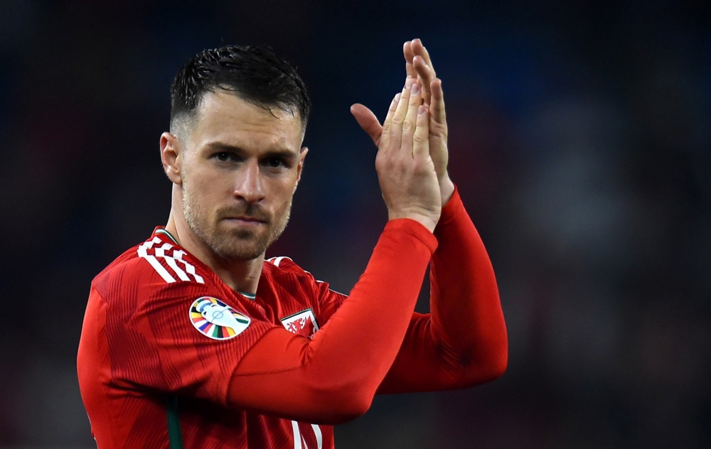 epa10547997 Aaron Ramsey of Wales applauds fans after the UEFA EURO 2024 qualification match between Wales and Latvia in Cardiff, Britain, 28 March 2023. Wales won 1-0.  EPA-EFE/Peter Powell