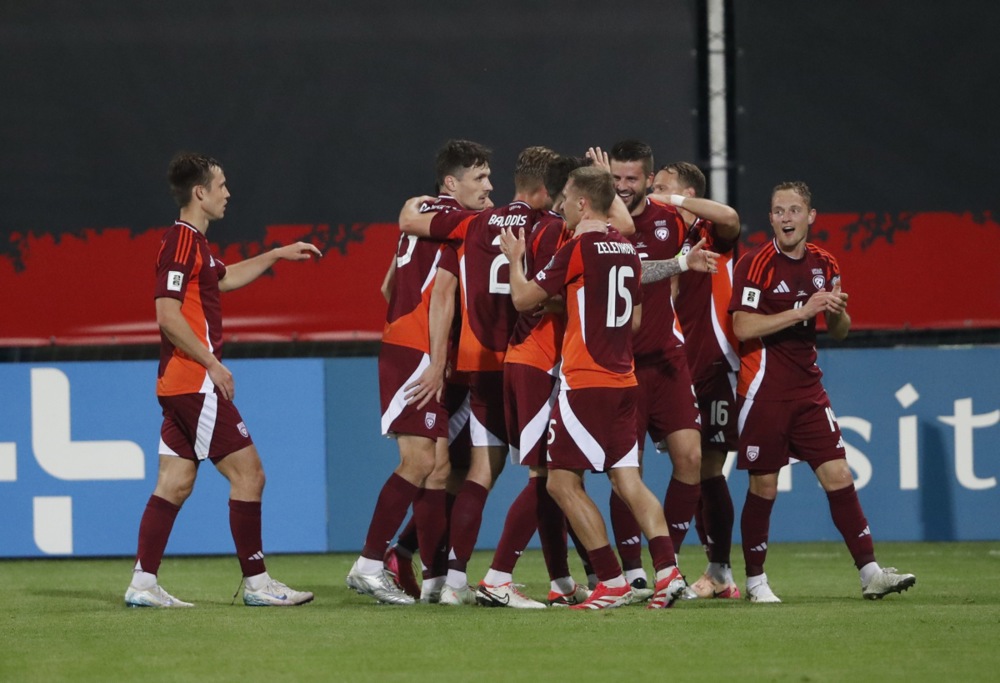 epa12168845 Players of Latvia celebrate the equalizer during the FIFA World Cup 2026 qualification match between Latvia and Albania in Riga, Latvia, 10 June 2025.  EPA-EFE/TOMS KALNINS