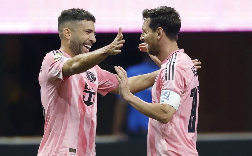 epa12186349 Lionel Messi (R) of Inter Miami celebrates with teammate Jordi Alba after the team won the FIFA Club World Cup 2025 match between Inter Miami and Porto in Atlanta, Georgia, USA, 19 June 2025. Miami won 2-1.  EPA-EFE/ERIK S. LESSER
