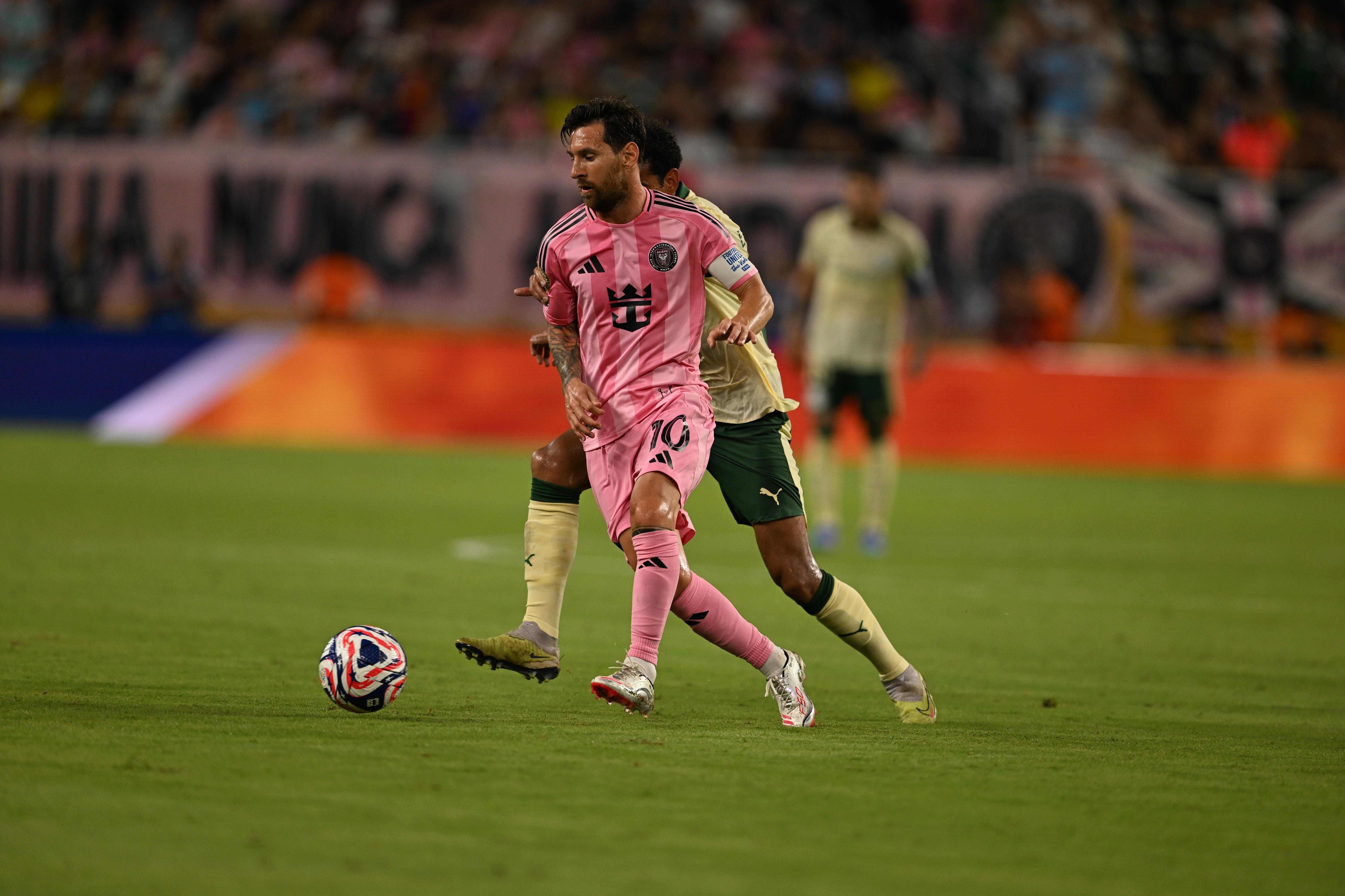 MIAMI GARDENS, FLORIDA - JUNE 23: Lionel Messi of Inter Miami CF (R) chased by Lucas Evangelista of SE Palmeiras (L) the ball during the FIFA Club World Cup 2025 group A match betweenInter Miami and SE Palmeiras  at Hard Rock Stadium on June 23, 2025 in M