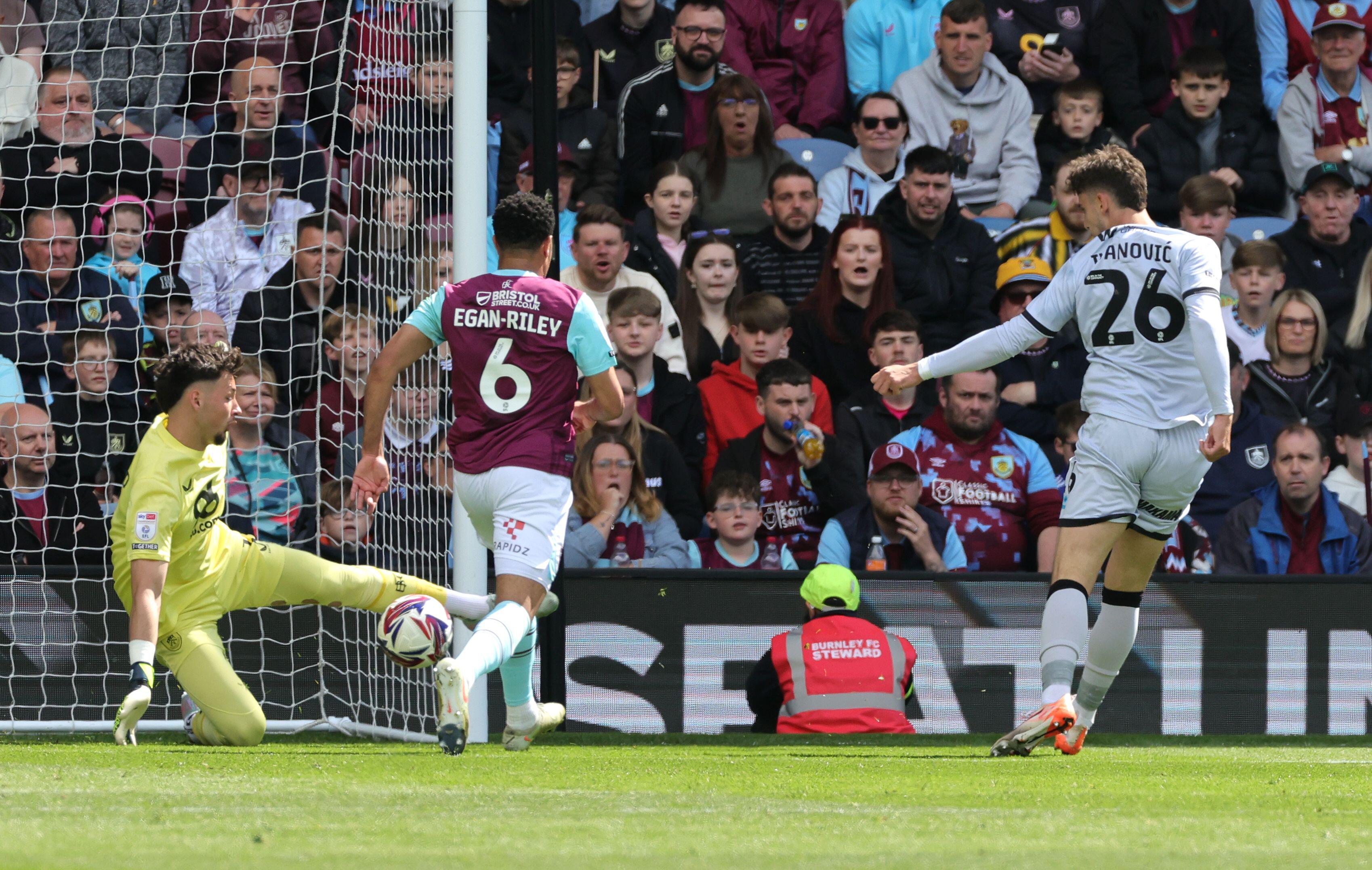 Millwall's Mihailo Ivanovic (right) scores their side's first goal of the game during the Sky Bet Championship match at Turf Moor, Burnley. Picture date: Saturday May 3, 2025.