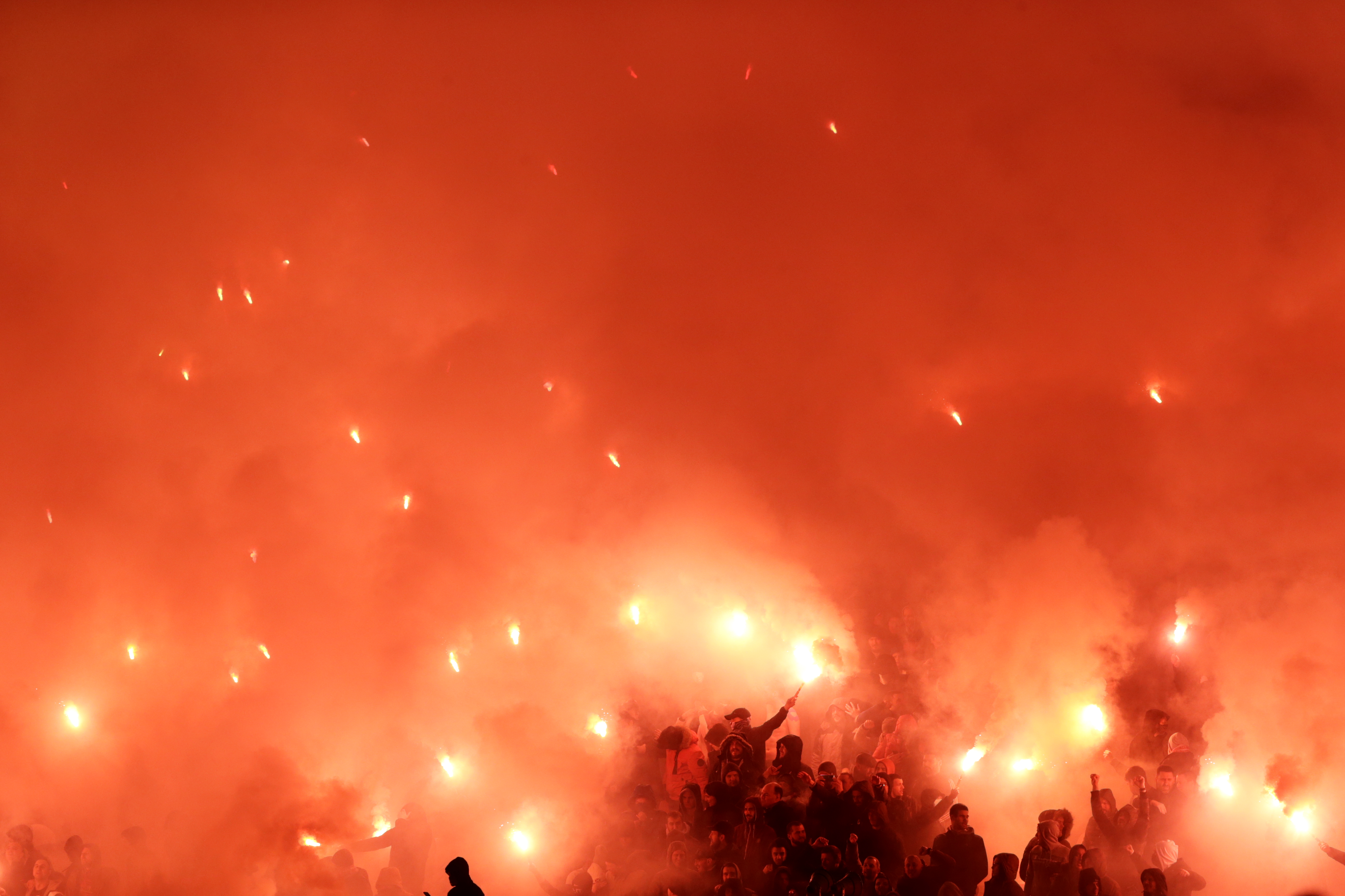 epa09789955 Supporters of Red Star light flares during the Serbian SuperLiga soccer match between Red Star and Partizan in Belgrade, Serbia, 27 February 2022.  EPA-EFE/ANDREJ CUKIC