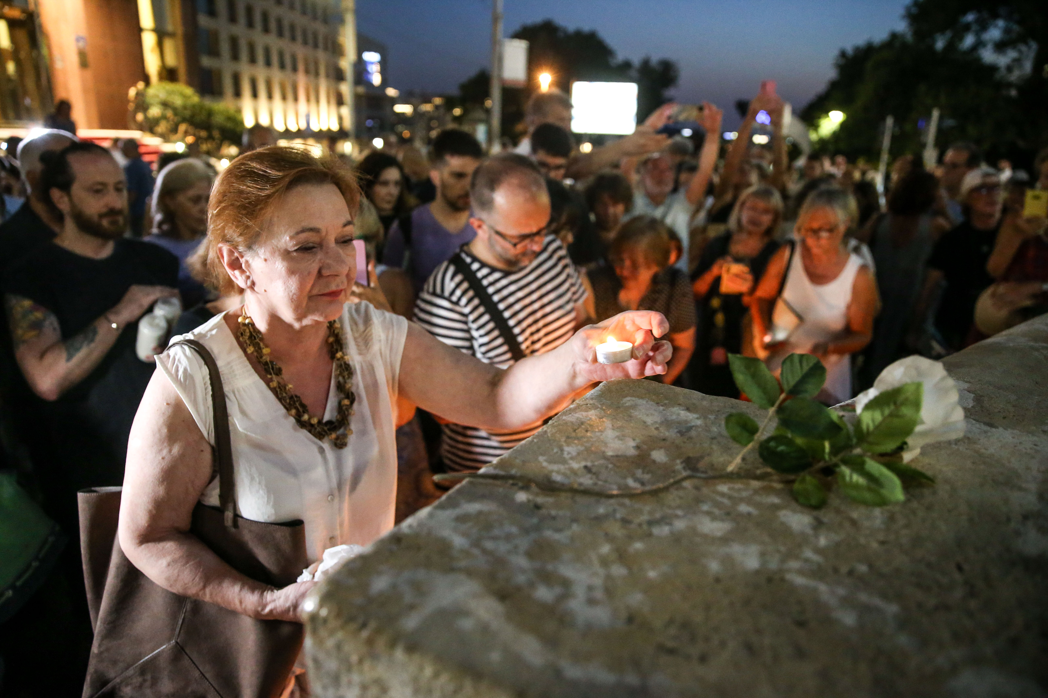 Citizens of Belgrade gathered at the Terazije fountain to light candles and lay flowers to honor Arsen and Matija Dedic and Gabi Novak.