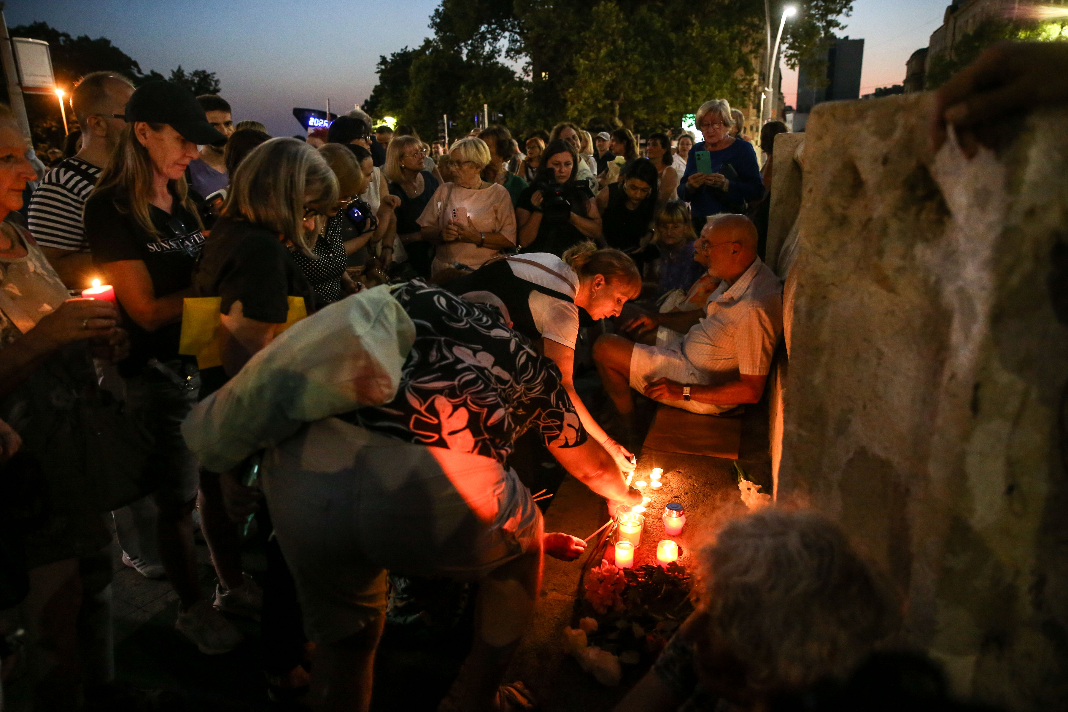 Citizens of Belgrade gathered at the Terazije fountain to light candles and lay flowers to honor Arsen and Matija Dedic and Gabi Novak.