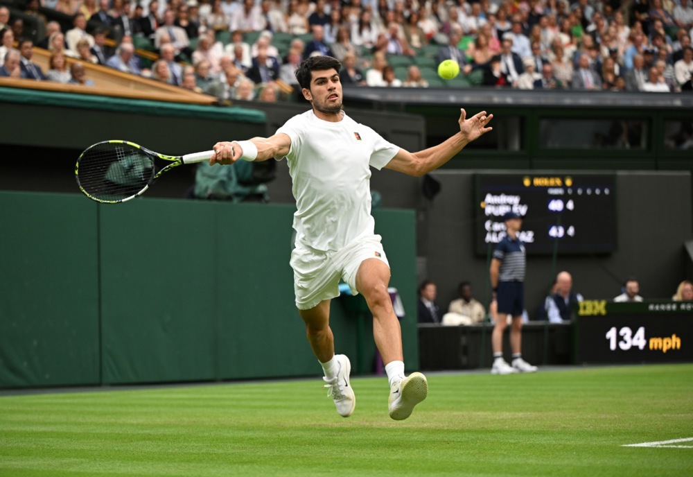 epa12220955 Carlos Alcaraz of Spain in action during the Men's Round of 16 match against Andrey Rublev of Russia at the Wimbledon Championships, Wimbledon, Britain, 06 July 2025.  EPA/DANIEL HAMBURY  EDITORIAL USE ONLY