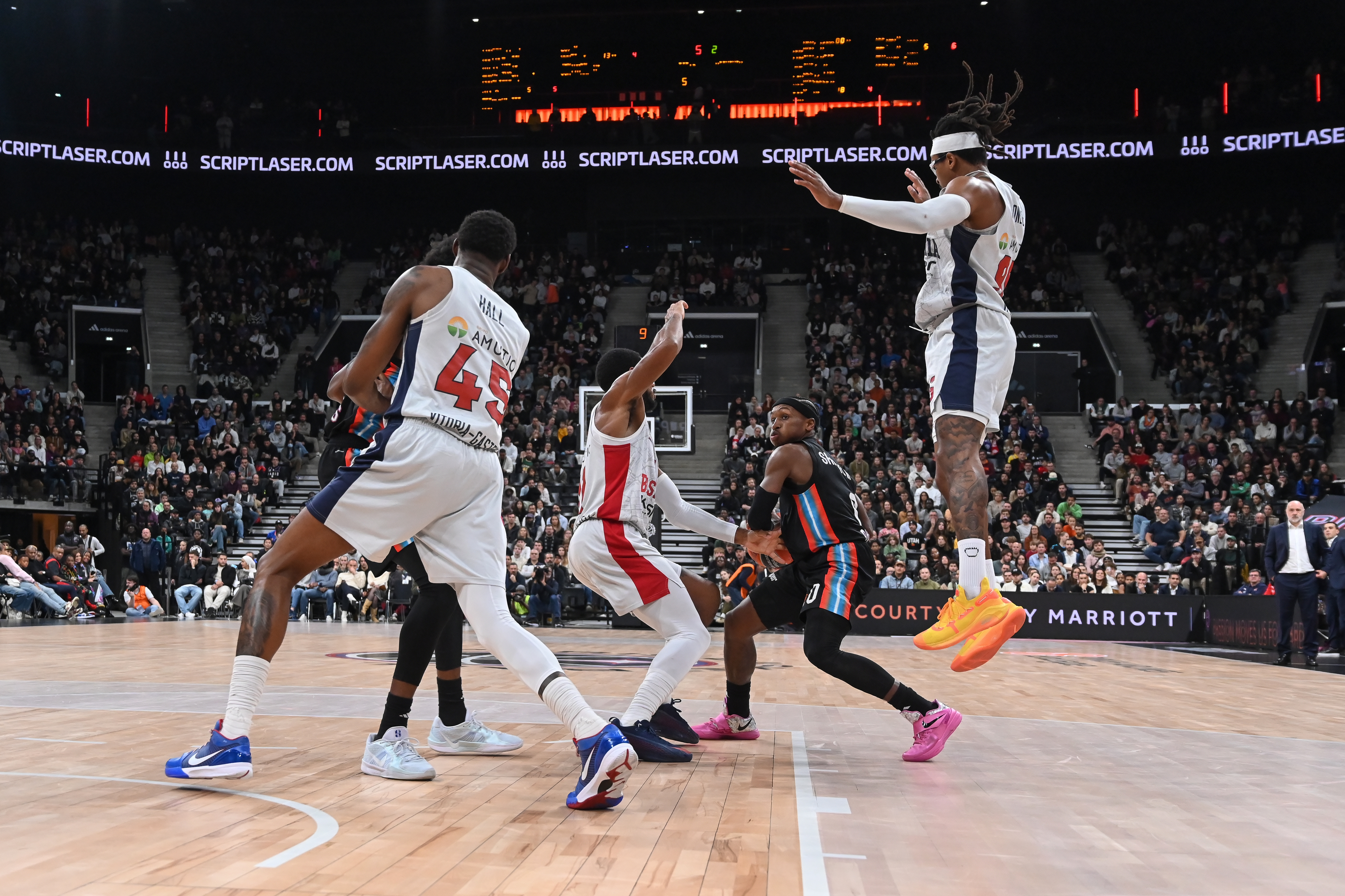 epa11696680 T.J. Shorts II (2-R) of Paris Basketball in action during the EuroLeague game between Paris Basketball and Saski Baskonia at the Adidas Arena, in Paris, France, on 01 November 2024.  EPA-EFE/Julien Mattia