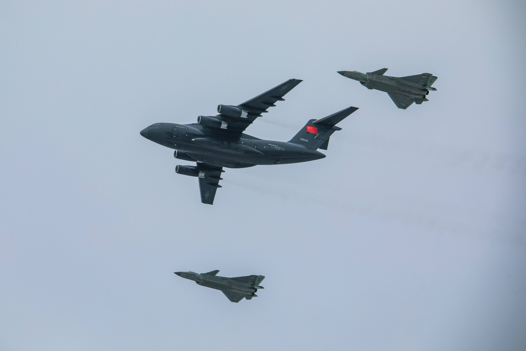 SHENYANG, CHINA - NOVEMBER 28: A Y-20 military transport aircraft carrying Chinese People s Volunteers (CPV) martyrs rem