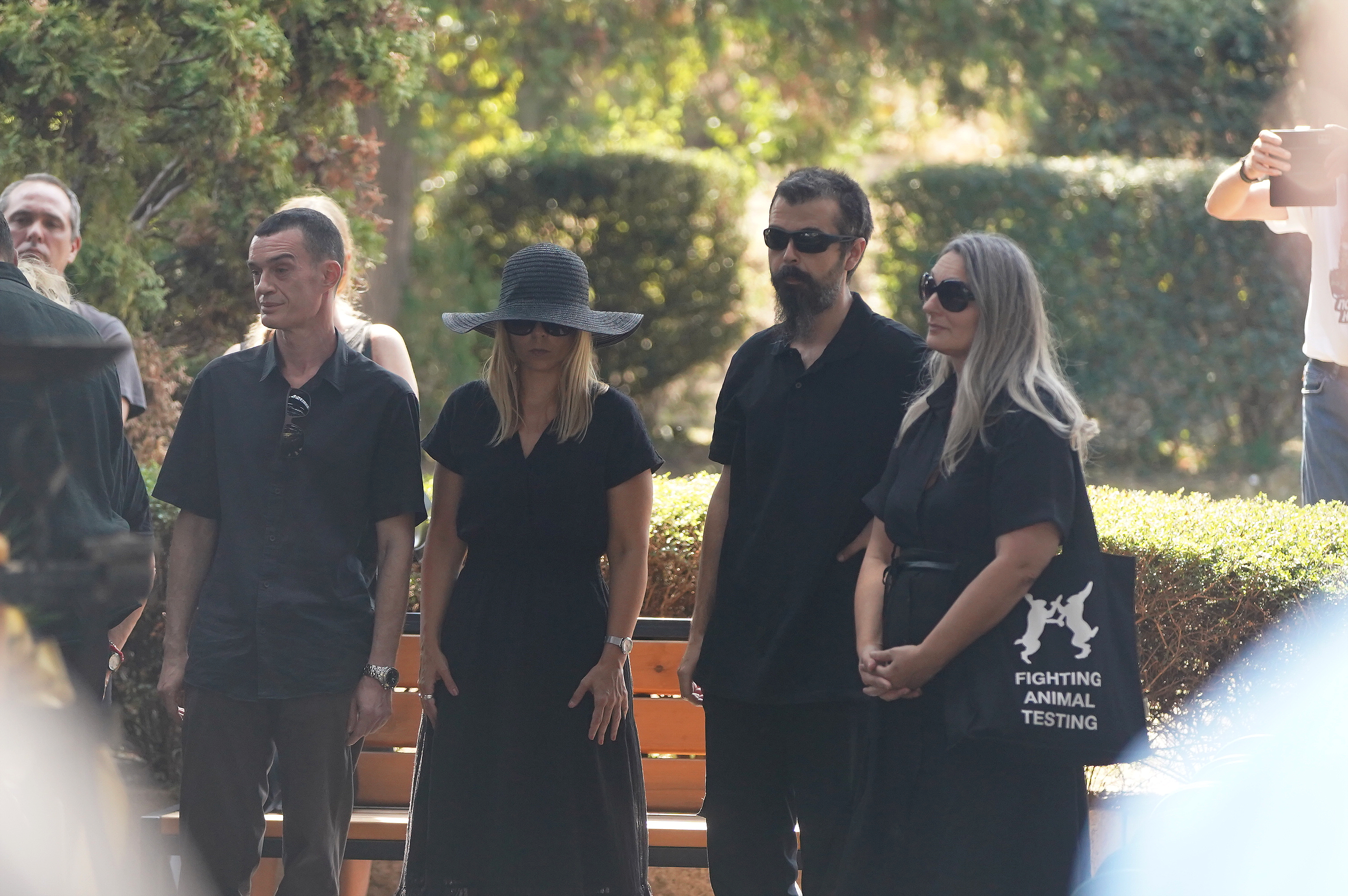 In front of the chapel at the City Cemetery in Cacko, there is a chest with Bora's body, and wreaths with farewell messages are placed around it.