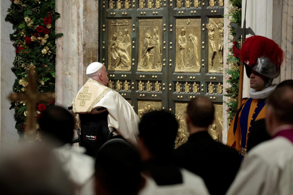 epa11792423 Pope Francis opens the Holy Door to mark the opening of the 2025 Catholic Holy Year, or Jubilee, in St. Peter's Basilica, at the Vatican, 24 December 2024.  EPA-EFE/REMO CASILLI / POOL
