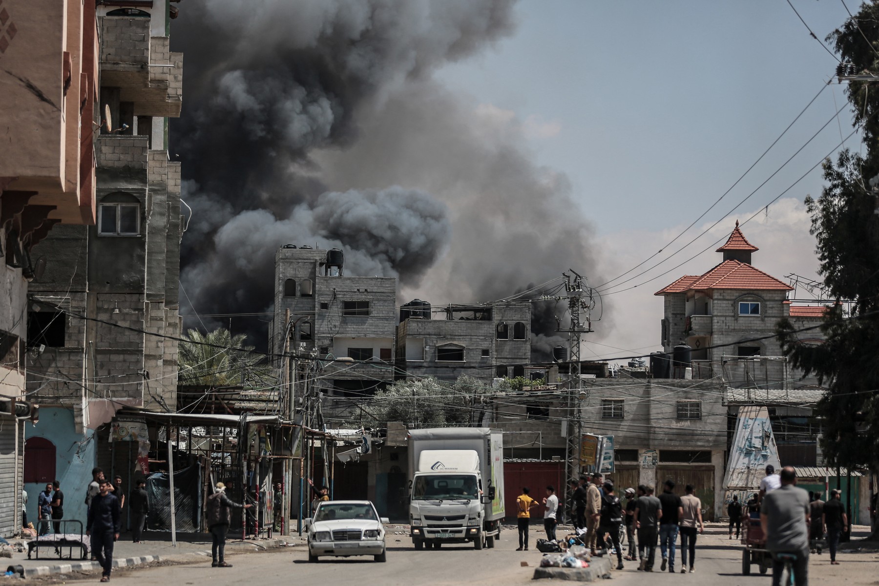 Smoke rises from shopping center following Israeli airstrike on Rafah