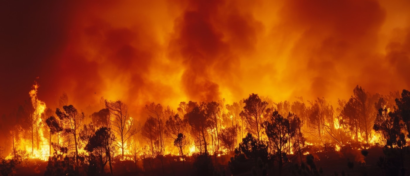 A massive, out-of-control forest fire burns through the landscape, with towering flames and billowing smoke creating an apocalyptic scene of nature's destructive power.