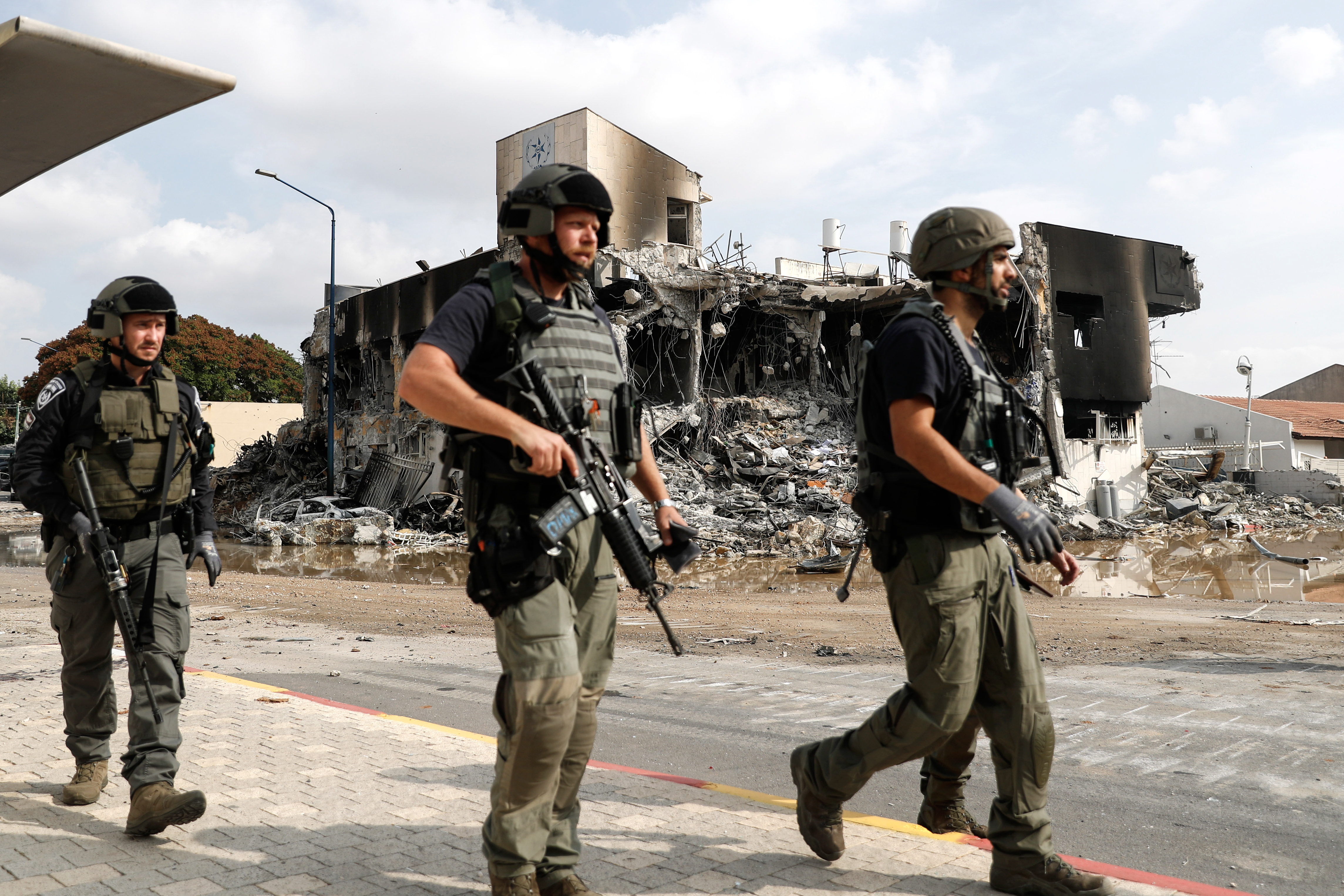 Israeli forces patrol the area near destroyed police station in Sderot