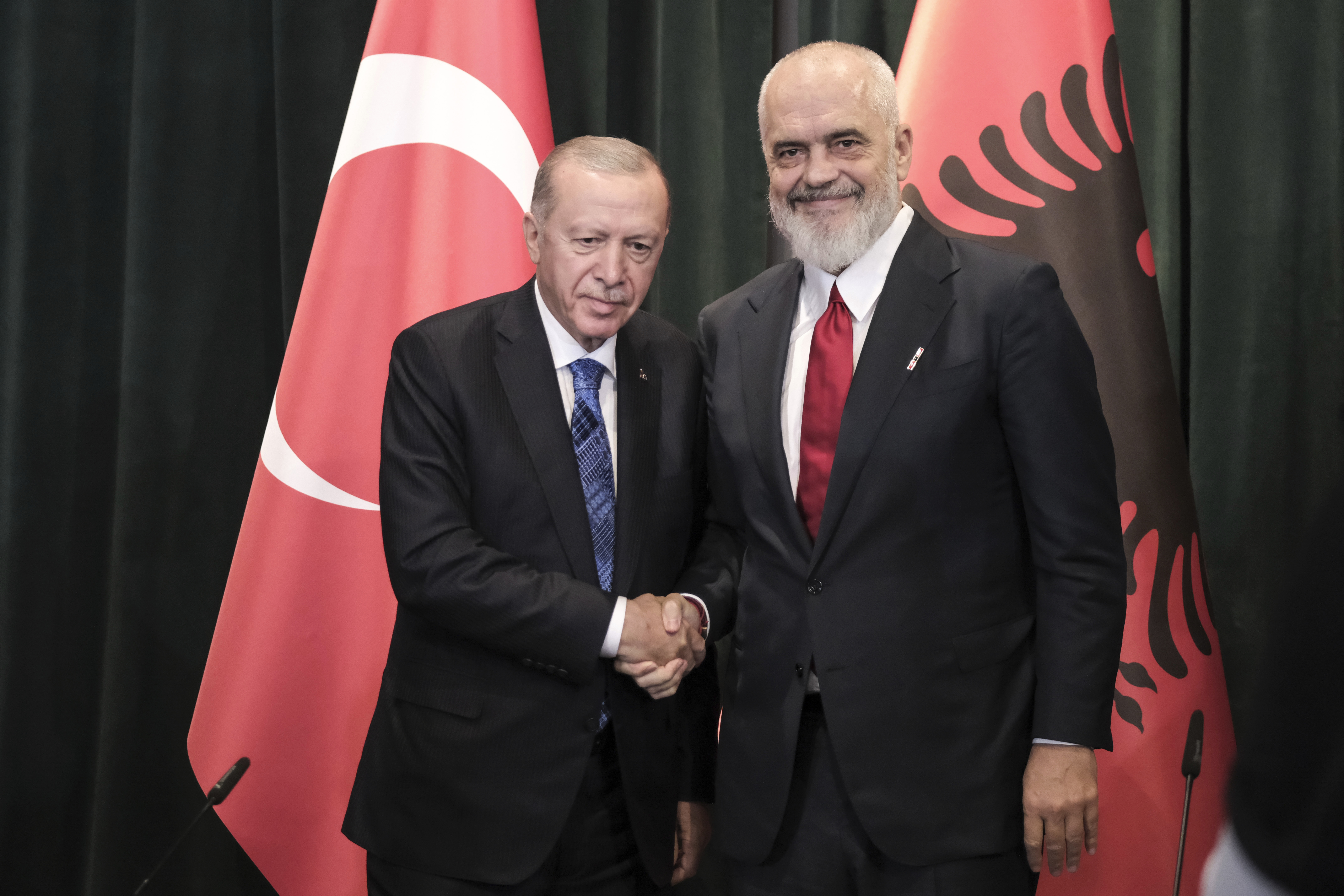 Prime Minister of Albania Edi Rama, right, shakes hands with Turkey's President Recep Tayyip Erdogan during a join news conference after they sing bilateral agreements in Tirana, Albania, Thursday, Oct. 10, 2024. (AP Photo/Vlasov Sulaj)