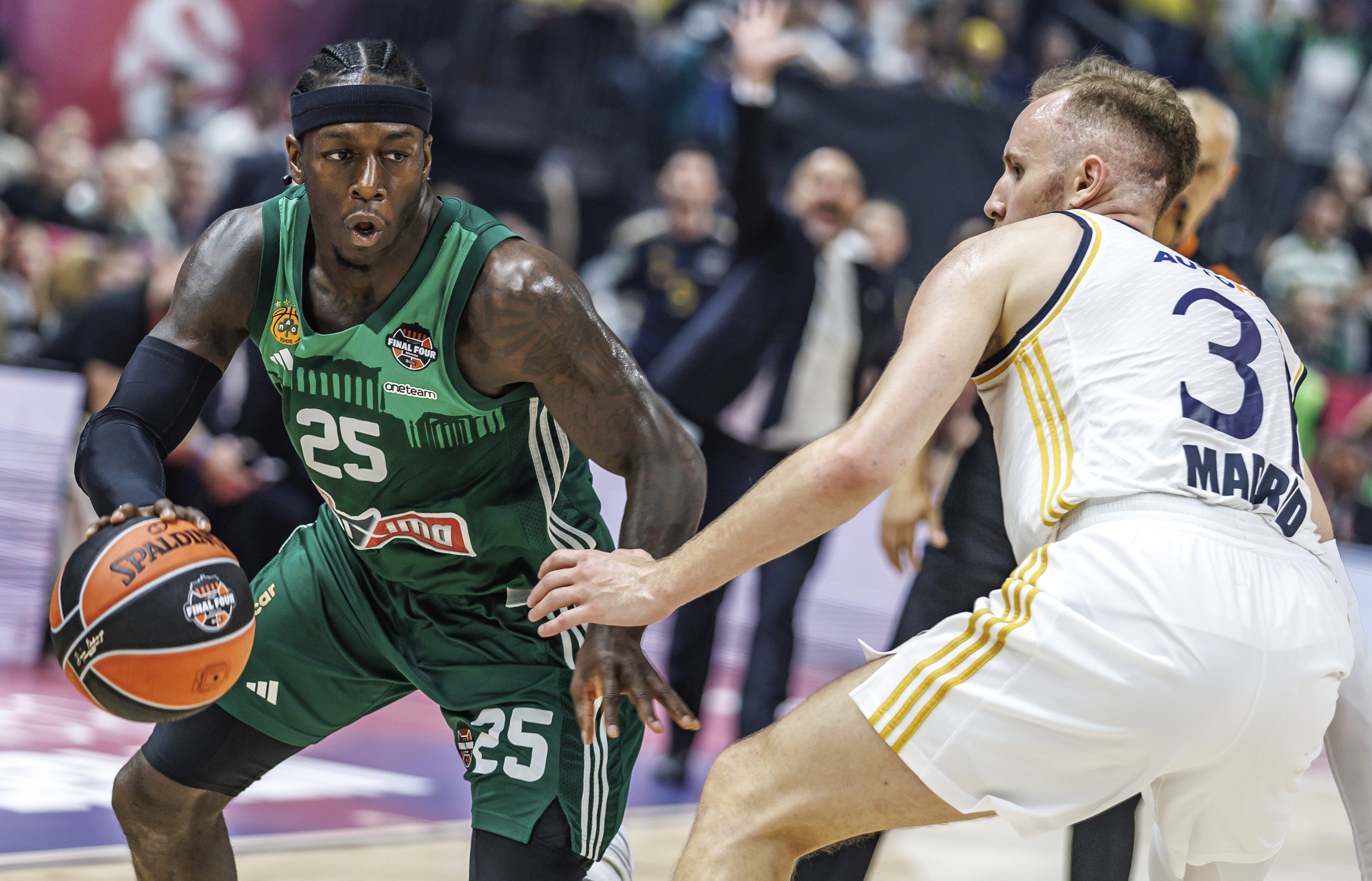 Kendrick Nunn of Panathinaikos Athens, left, and Madrid's Dzanan Musa in action during the Euroleague final round, Final Four, Final between Real Madrid and Panathinaikos Athens at the Uber Arena in Berlin, Sunday May 26, 2024. (Andreas Gora/dpa via AP)