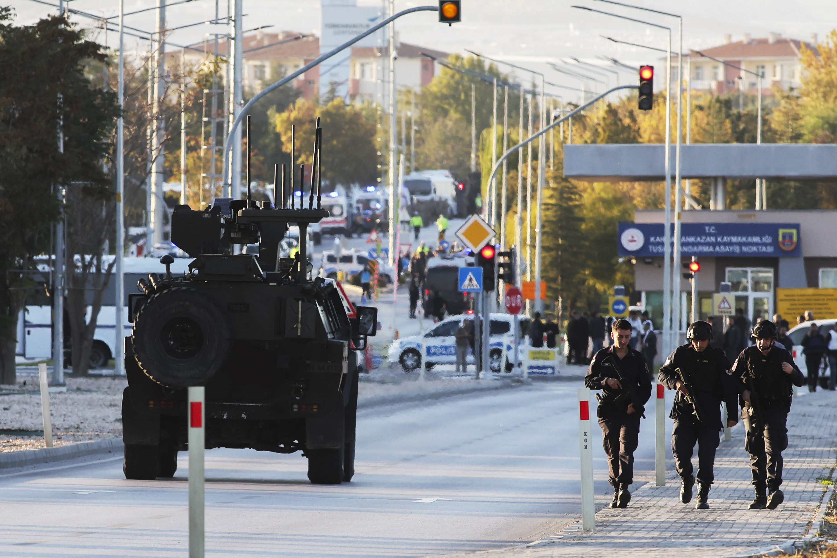 Emergency and security teams are deployed outside the Turkish state-run aerospace and defense company Turkish Aerospace Industries Inc. on the outskirts of Ankara, Turkey, Wednesday, Oct. 23, 2024. (Yavuz Ozden/Dia Photo via AP)