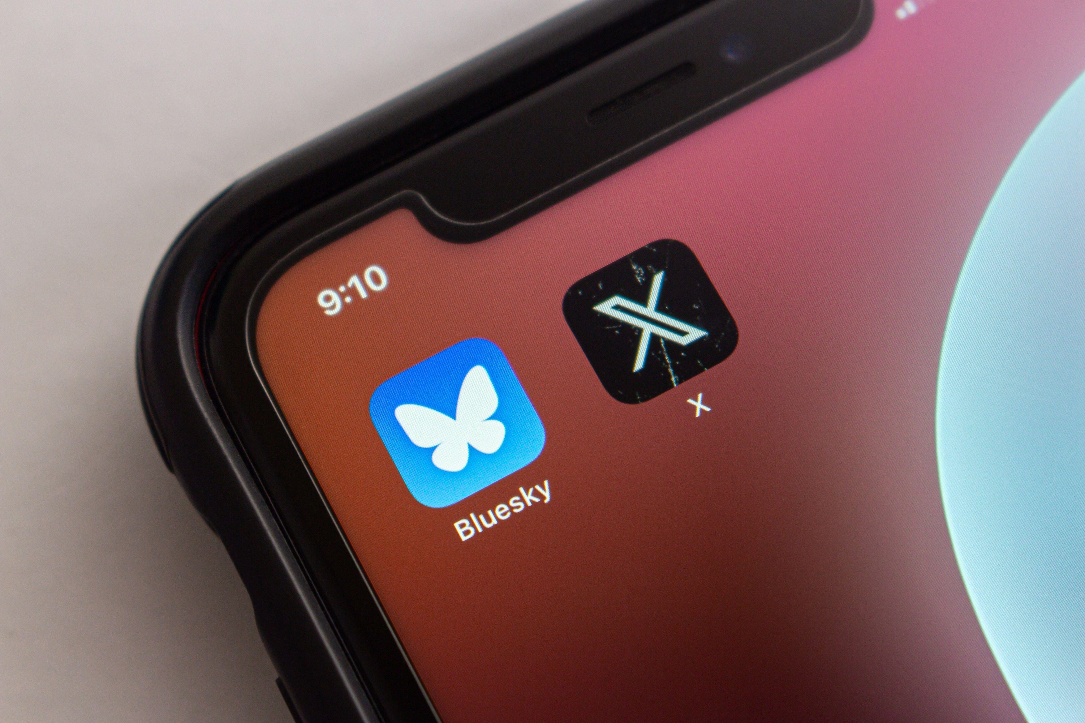 Mexico City, MEXICO - Oct 22 2024 : Bluesky Social and X app are displayed in an iPhone screen.