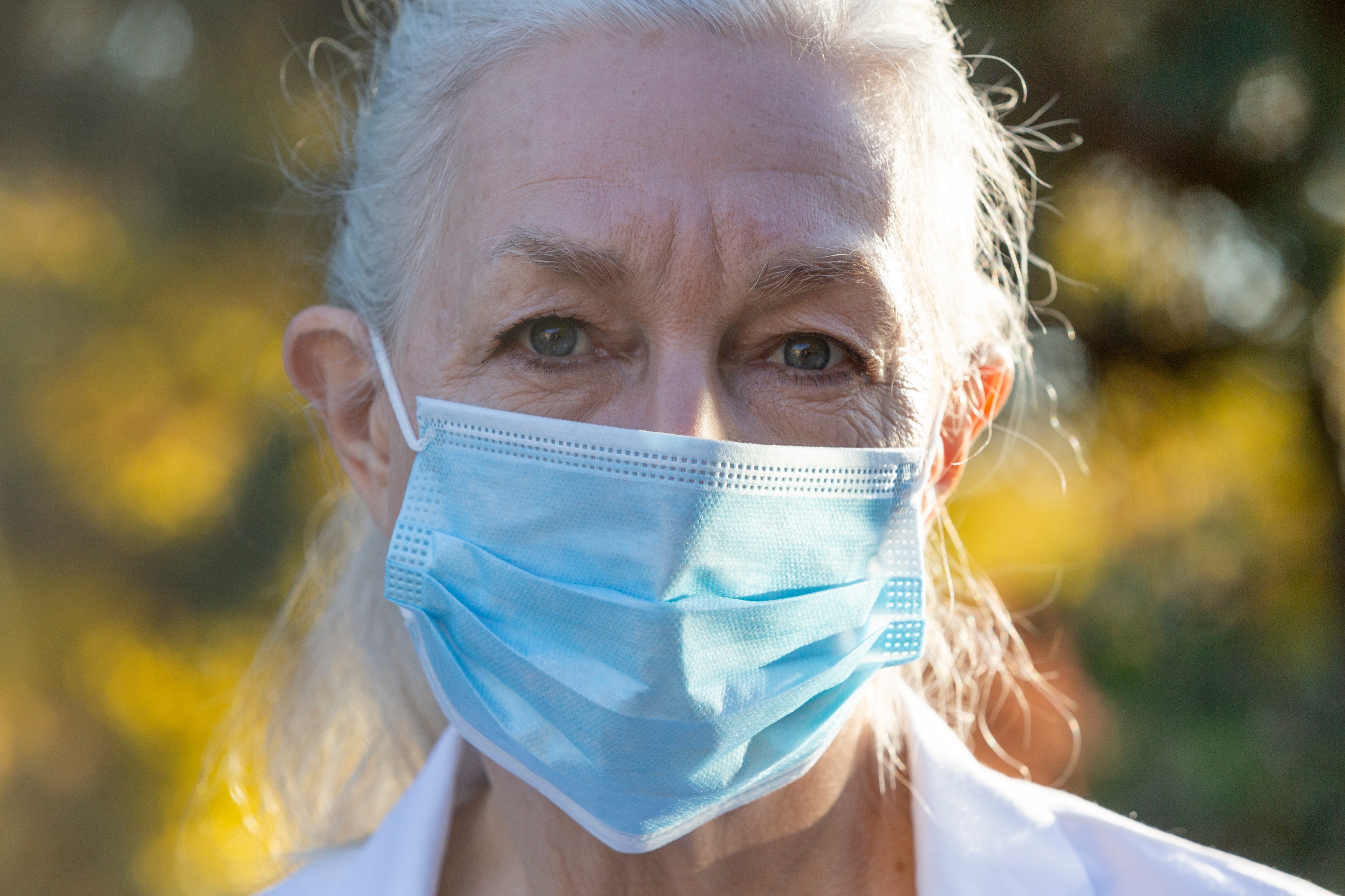 Portrait of senior female medical staff in covid protective mask