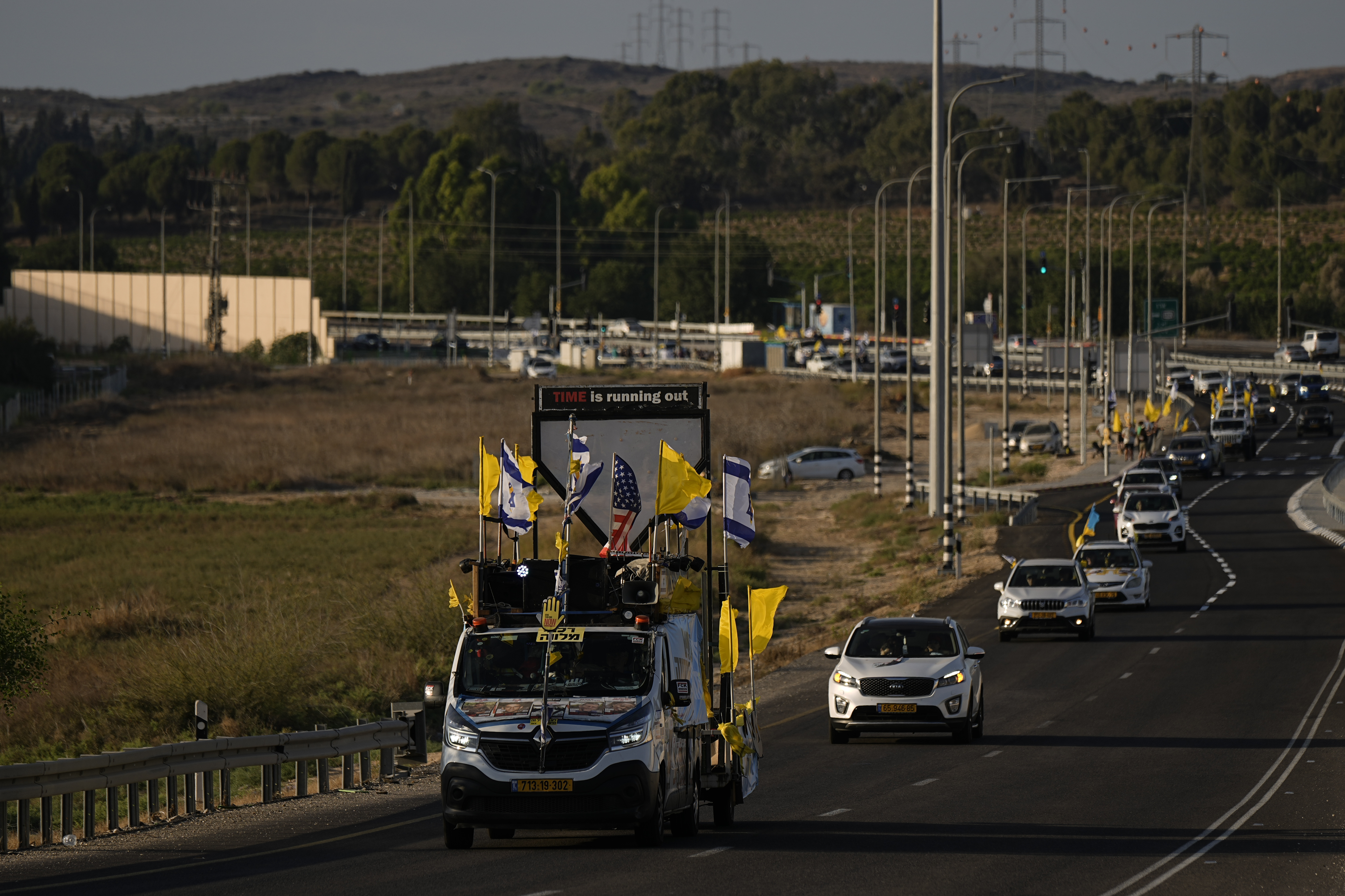 Relatives and friends of hostages held in the Gaza Strip by the Hamas militant group take part in a convoy of vehicles to the Gaza border, near Sderot, southern Israel, Wednesday, Aug. 28, 2024. (AP Photo/Tsafrir Abayov)