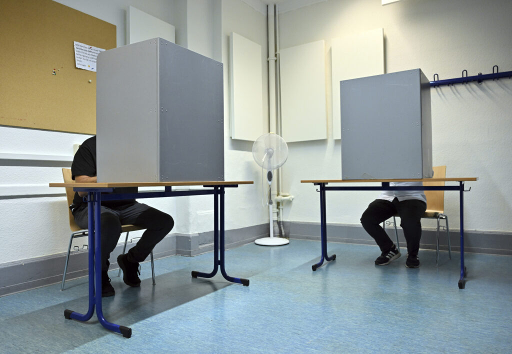 Voters cast their ballots at a polling station in Erfurt, Germany, Sunday, Sept. 1, 2024. (Martin Schutt/dpa via AP)