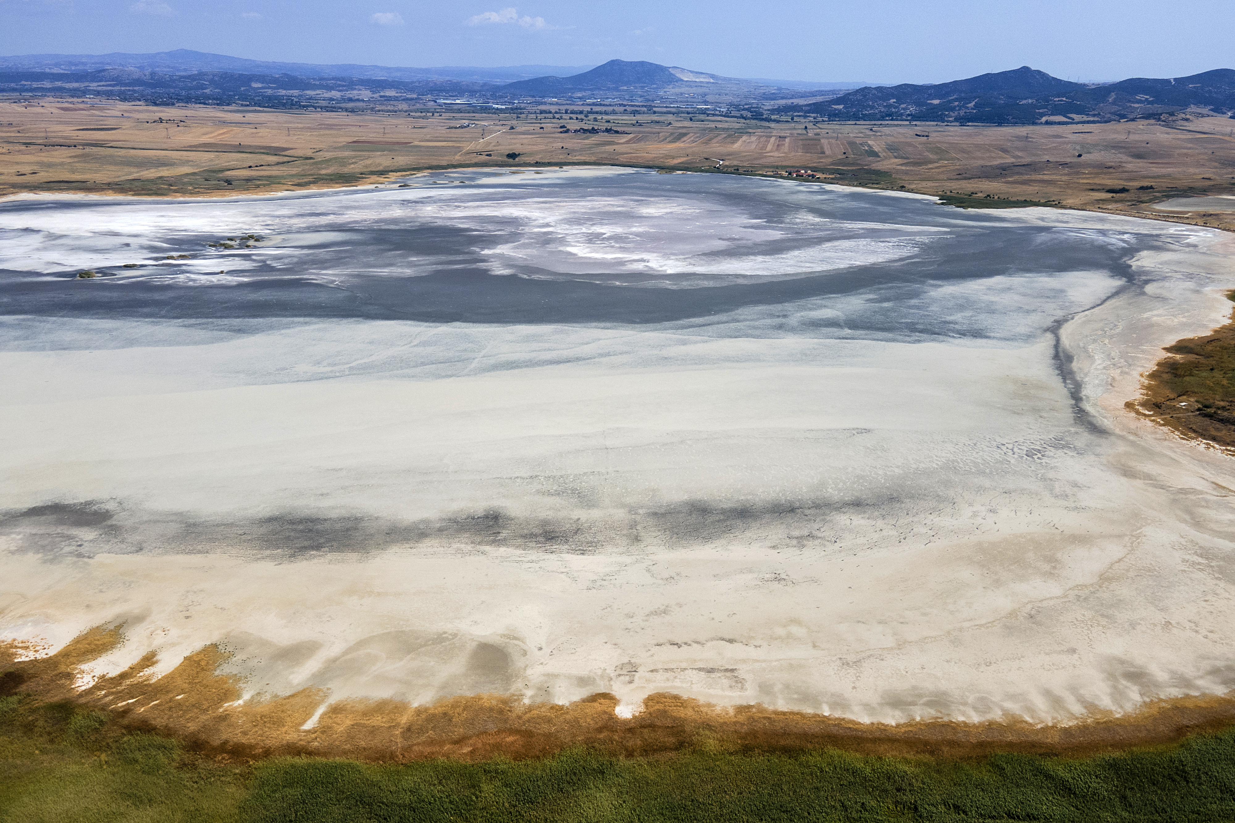 An aerial view of the dried bed of Lake Picrolimni amid a severe drought, near Mikrokampos, Greece, Aug. 19, 2024. (AP Photo/Giannis Papanikos)