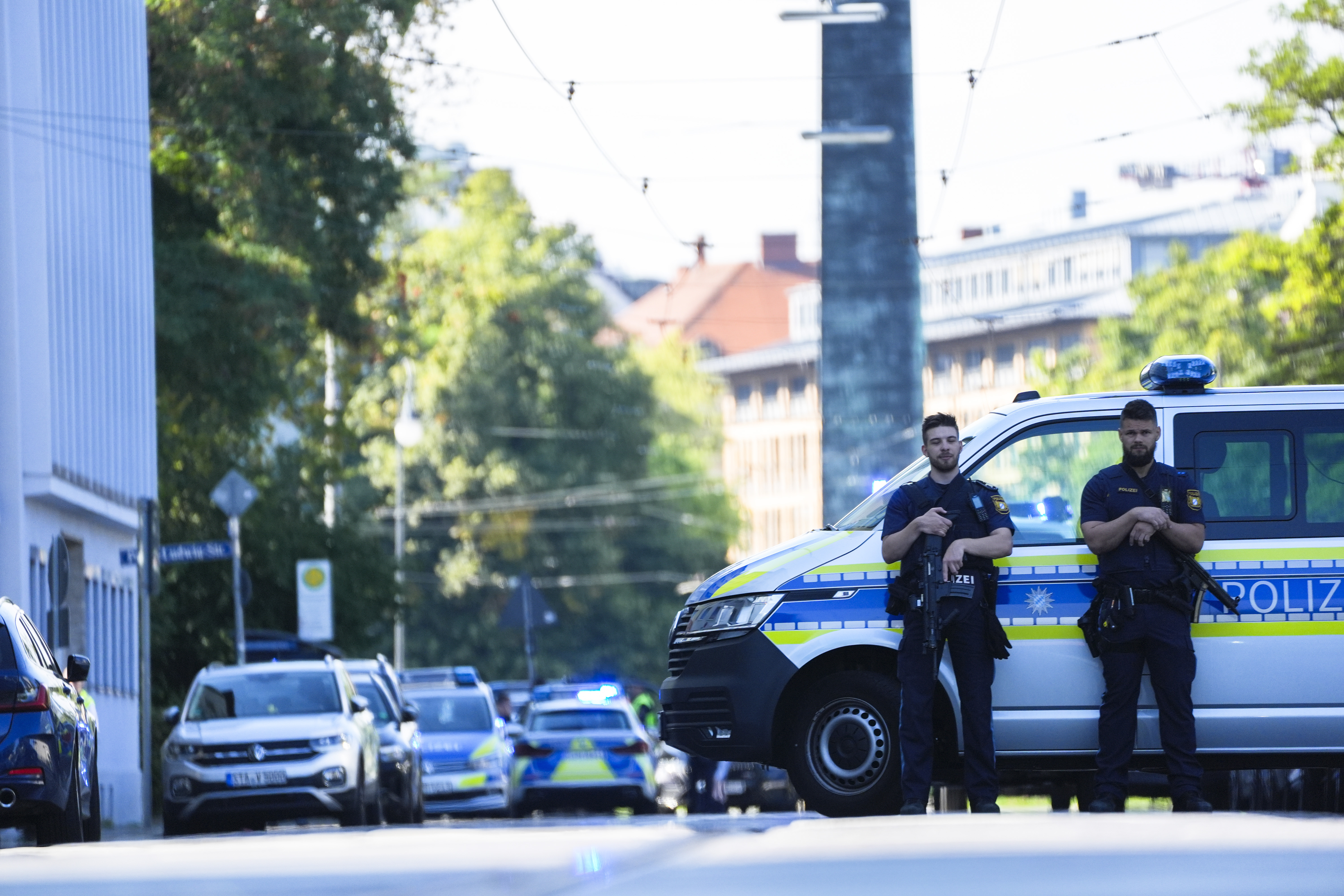 Police officers block a street after police fired shots at a suspicious person near the Israeli Consulate and a museum on the city's Nazi-era history in Munich, Germany, Thursday, Sept. 5, 2024. (AP Photo/Matthias Schrader)