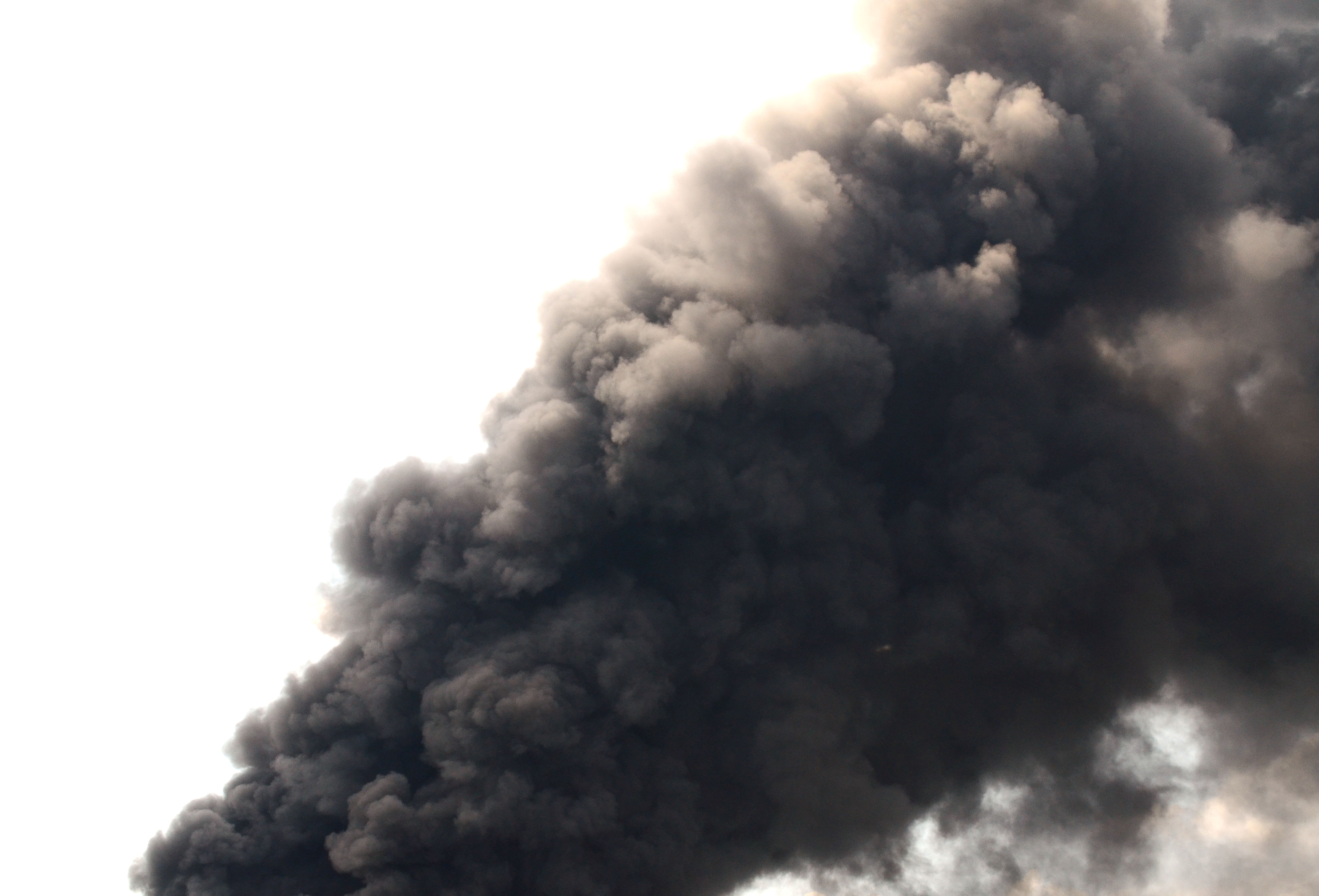 A,Thick,And,Dark,Smoke,From,A,Fire,,Flooding,The