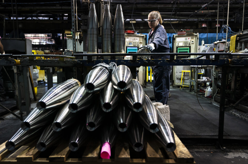 FILE -A steel worker moves a 155 mm M795 artillery projectile during the manufacturing process at the Scranton Army Ammunition Plant in Scranton, Pa., Thursday, April 13, 2023.   (AP Photo/Matt Rourke, File)