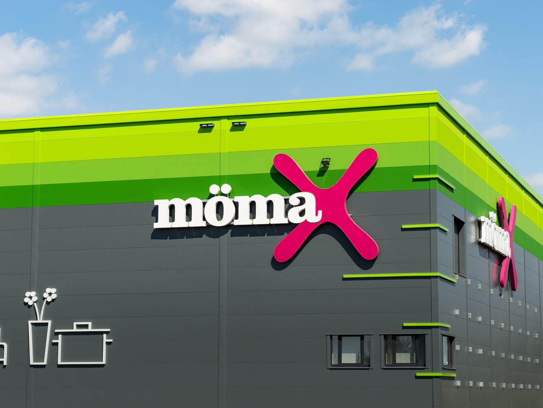 Mmax logo sign on the store building exterior. Furniture store with trendy products for a home improvement. Economic prices are a USP of the business