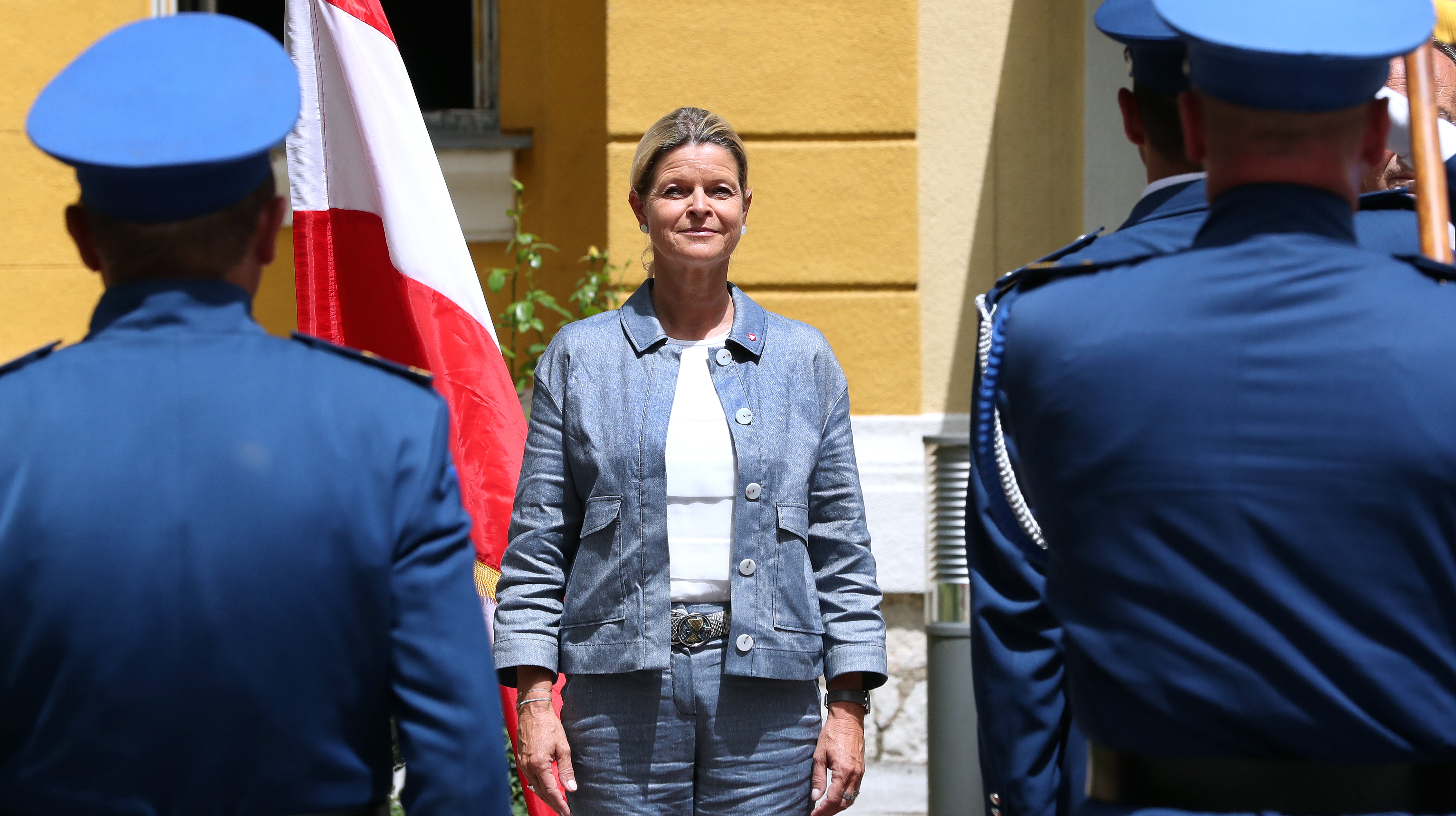 epa09293004 Austrian Defence Minister Klaudia Tanner (C) inspects a guard of honour during a welcome ceremony in Sarajevo, Bosnia and Herzegovina, 22 June 2021.  EPA-EFE/FEHIM DEMIR
