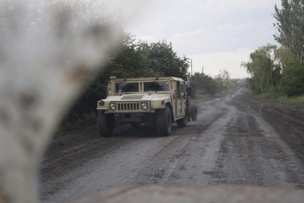 A Ukrainian military vehicle HMMWV travels on the road at the front line, near Bakhmut, Donetsk region, Ukraine, Friday, June 30, 2023. (AP Photo/Alex Babenko)