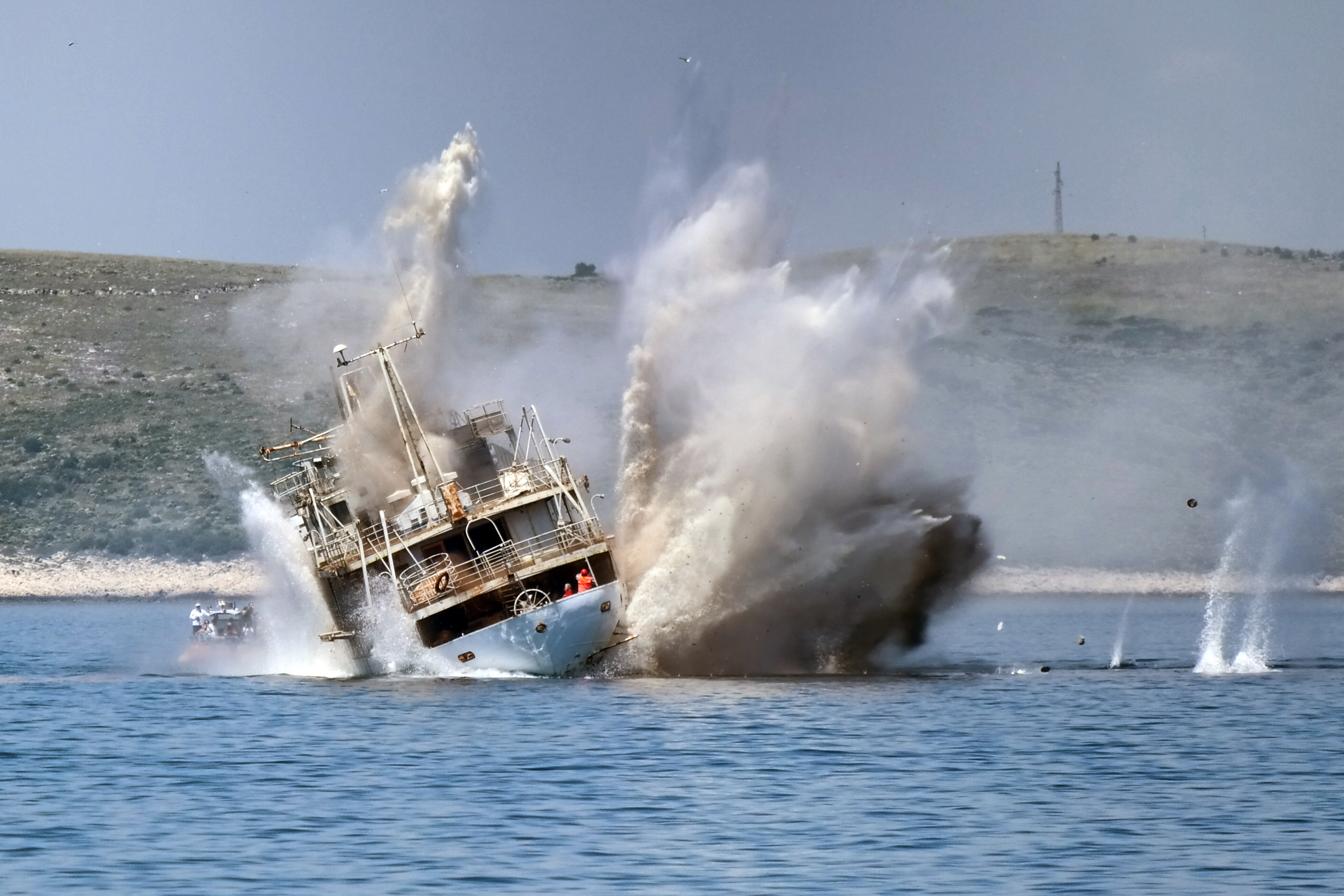 Sinking,Old,Navy,Ship,With,Explosion