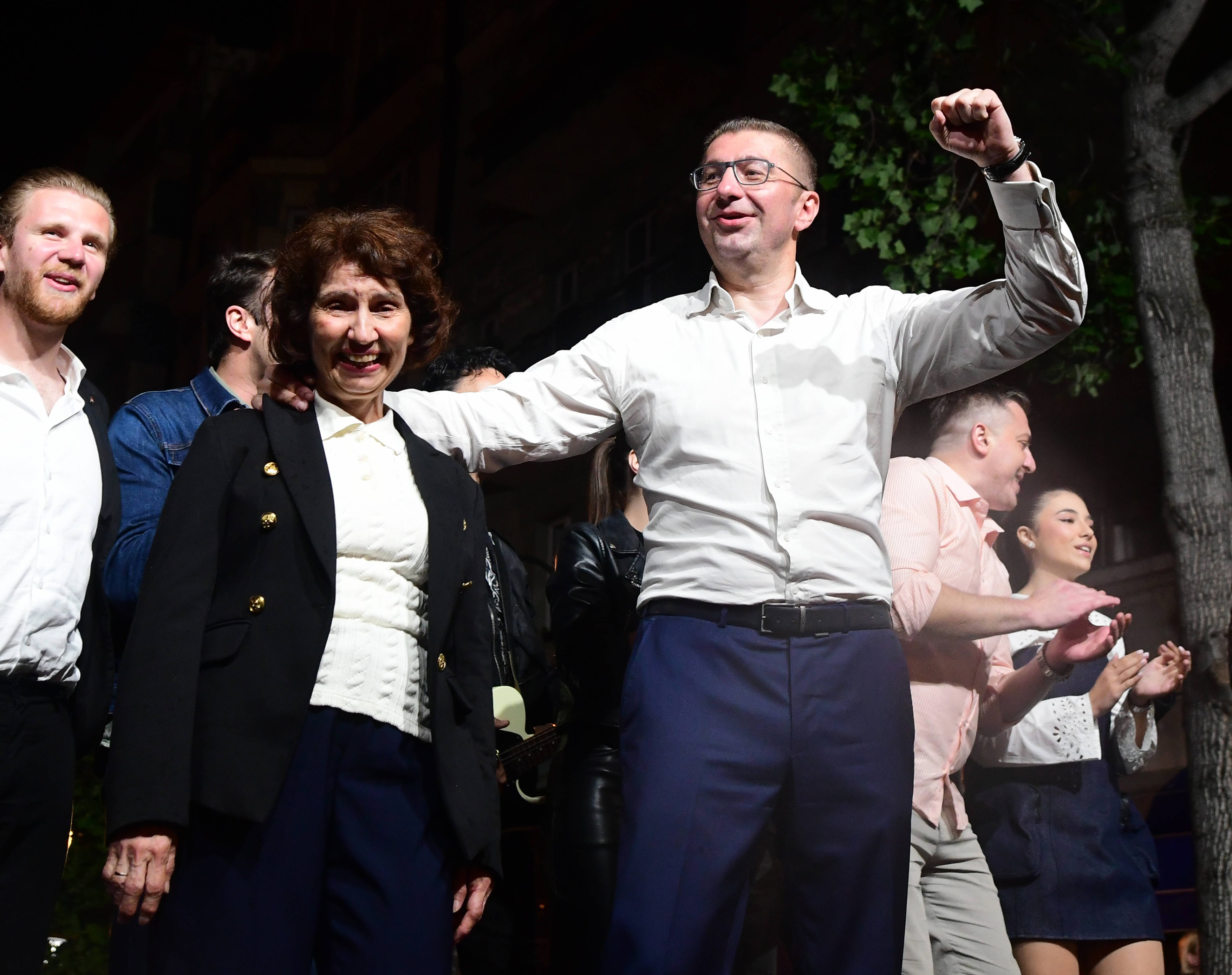 Hristijan Mickovski leader of VMRO-DPMNE party and Gordana Siljanovska Davkova celebrates with party members in Skopje,
